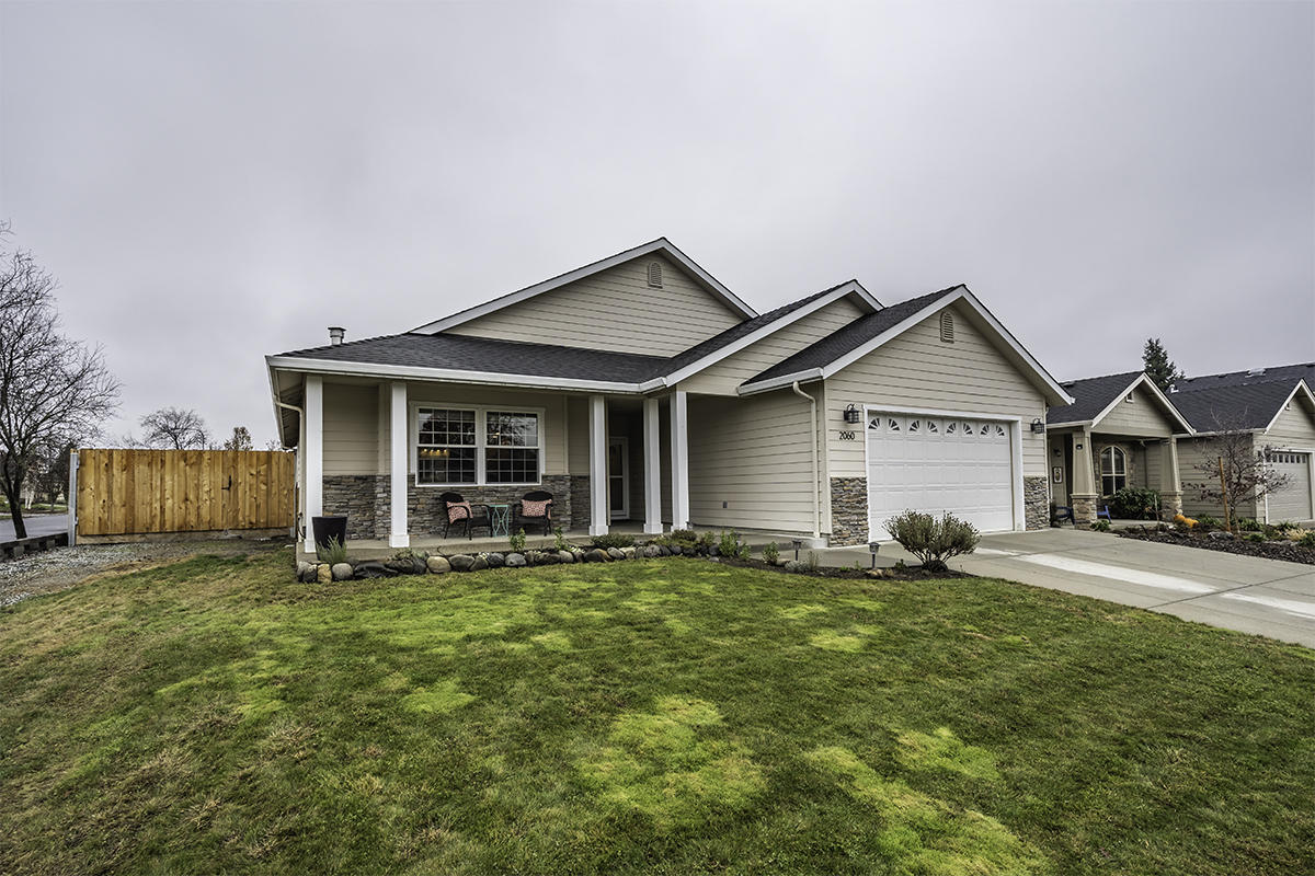 DON'T WAIT!!! This beautiful home has everything you need, along with it being in a great neighborhood.  With a vaulted great room and a gas fire place in the front room it has an elegant but cozy feel to it.  The kitchen and dining room also have vaulted ceilings (and fresh new carpets only a2 years old), which creates a continuous flow between the three rooms.  This home has three bedrooms that are all spacious and inviting.  The master bedroom offers a walk-in closet as well as dual sinks in the bathroom.  The backyard has a great covered patio, which has beautiful French doors leading back into the home. Do not forget about the side yard parking as well!
