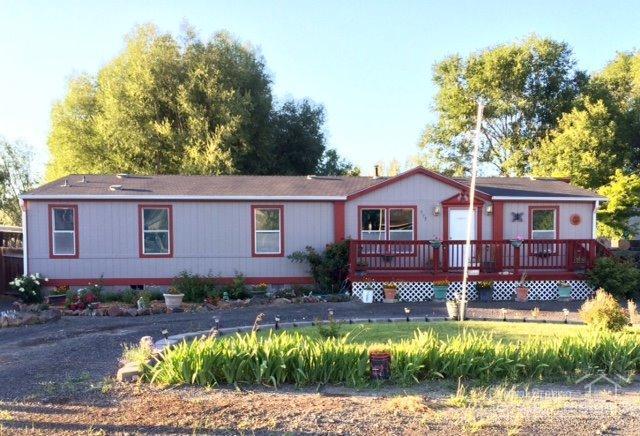 Nice clean home in town. Great floor plan with a large kitchen and tons of storage. Nice lot with a fenced yard with fruit trees, greenhouse and private well for irrigation. The exterior of the home has recently been painted. Two decks perfect for entertaining!