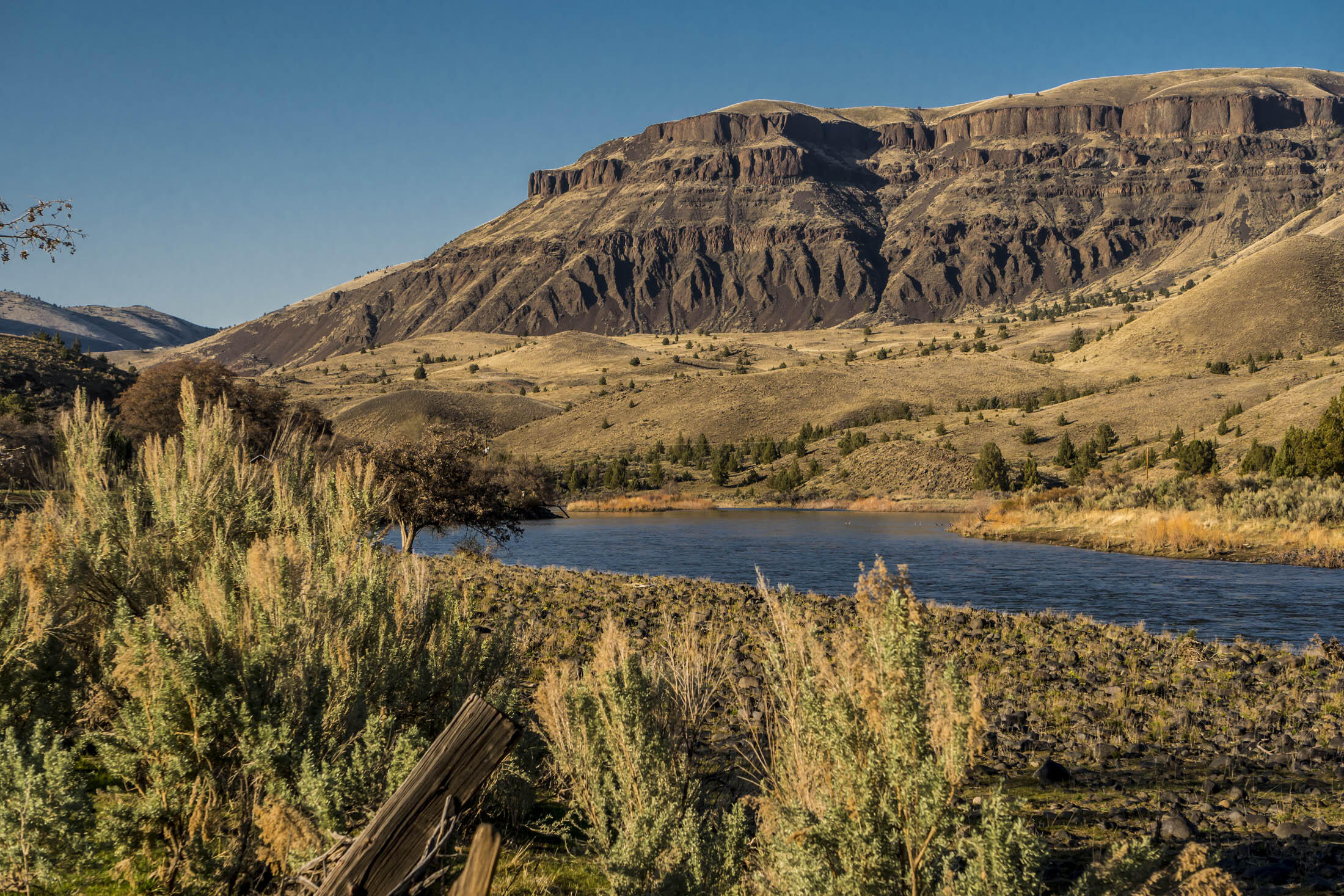You will never get tired of the expansive horizons and towering vistas of this amazing landscape! Set along the banks of the mighty John Day River this historic ranch encompasses 6,397.27± deeded acres, plus BLM grazing permits covering an additional 2,663± acres, with the John Day River winding along and through the ranch for 4.5± miles. Additionally, adjoining BLM land grazed by the neighbors totals 3,741± acres along another 4.5± miles of John Day River frontage, accessible only from the river, or adjoining private lands. There is a residence, power and water at the ranch headquarters. If you are an avid hunter, or angler, this ranch is for you. It is one of the few ranches that boasts the rare combination of quality upland gamebird, waterfowl, and big game hunting, plus fly fishing for steelhead and smallmouth bass!