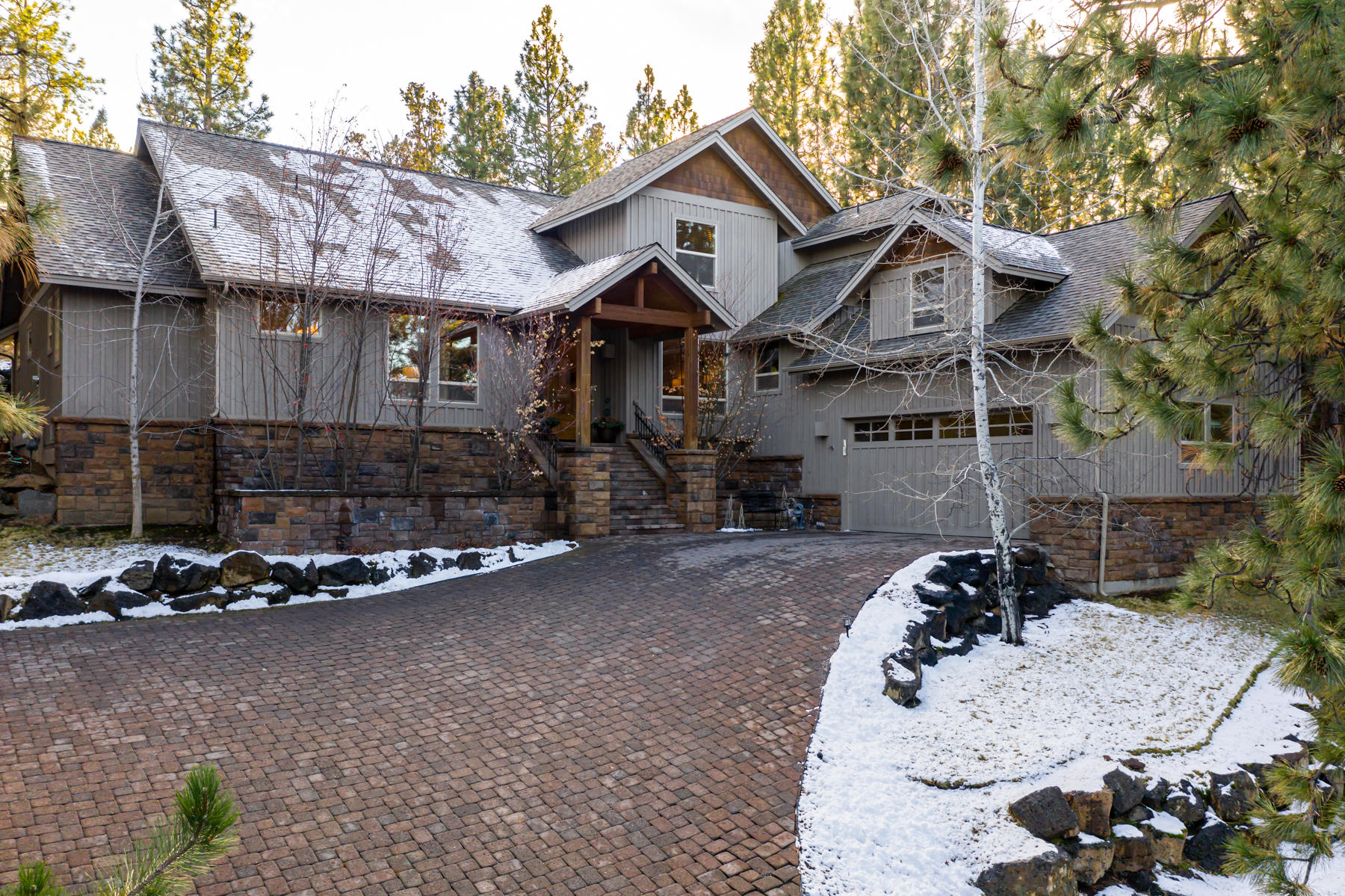 Welcome home to this gorgeous, luxury, well thought-out Awbrey Glen estate home in NW Bend, nestled in the pines and built with exceptional quality! Boasting two master bedrooms, this home has one beautiful master on the main level + office, 2 dining areas, a large, spacious living room with grand fireplace, beautiful vaulted open beam ceilings and generous windows, huge walk-in pantry and high-end kitchen. Don't miss the downstairs half bath, laundry room and extra office space. Second level affords another master and ensuite bathroom with large deck to take in the outdoors, additional guest bedroom + full bath and large bonus room/flex space. Home features a heated, paver driveway, 3 car attached tandem garage, large lot, and much sought-after private living. Fully landscaped, paver patio with much room for outdoor living and entertaining, this NW Bend home does not disappoint. Awbrey Glen is a gated, golf course community, affording a top quality life in Bend. Don't miss it!