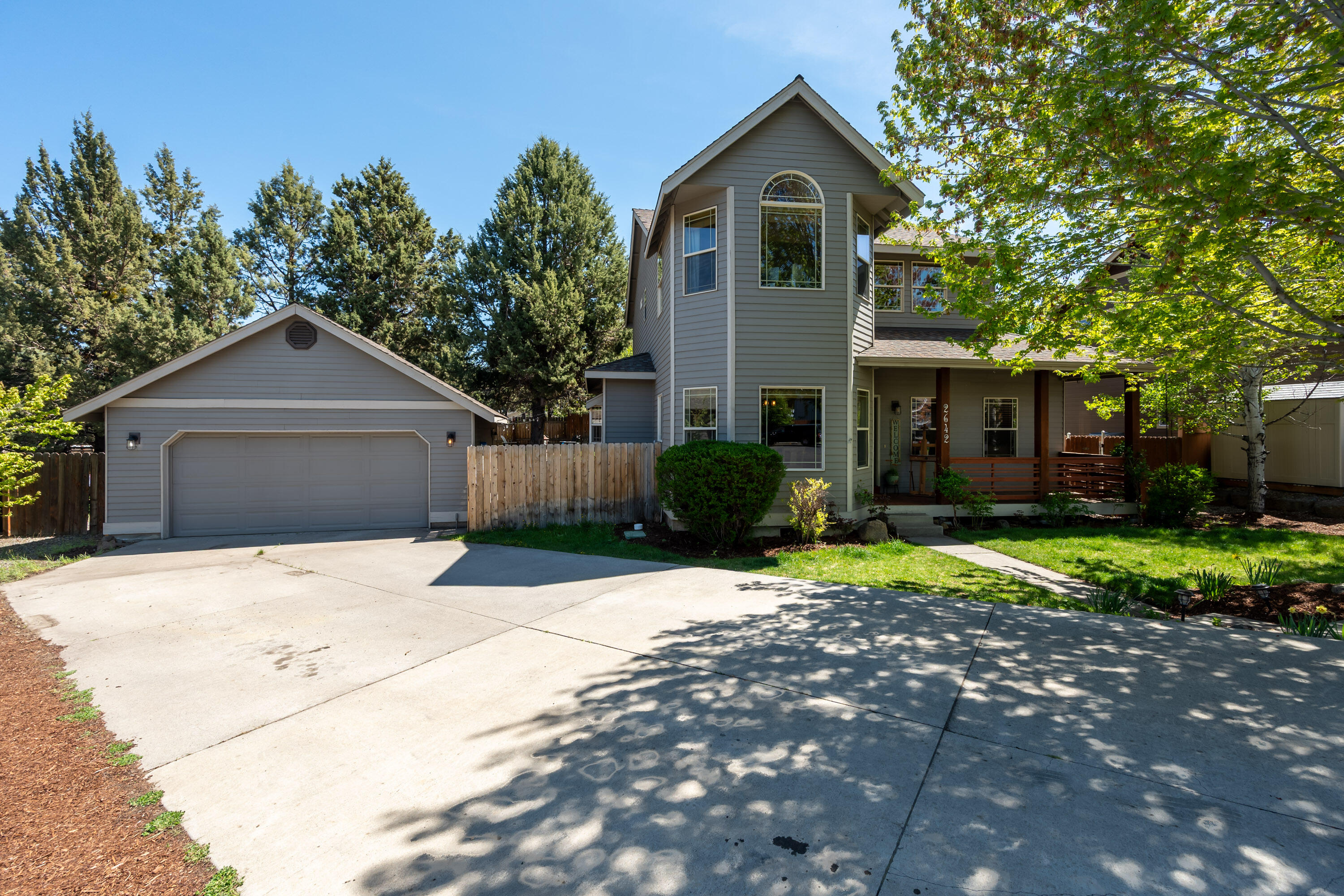 This home is a spacious 4 bedroom, 3 bathroom on .21 of an acre in a quiet cul-de-sac with ample parking a large detached 2 car garage, and great STR potential! This home features exquisite finishes to include, tile and newly installed engineered hardwood flooring as well as an updated kitchen and bathrooms. Upon entering the main level of this home you will find a sizable living room with natural gas fireplace, large kitchen with separate dining area and a generously sized guest bedroom and a full bathroom. The second floor primary is oversized with an additional area that could be used as a sitting area, office or dressing room. The bathroom has dual vanity sinks and a shower/soaker tub combo. The two additional bedrooms upstairs are generously sized as well. Outside you will find a nicely landscaped yard with sitting areas and plenty of space to relax and enjoy.