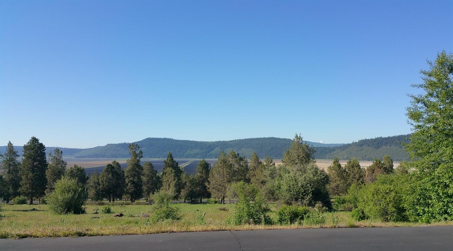 Scenic views in a peaceful setting. Large .86 acre lot in the West Ridge area of Running Y is ready for your dream home. Amenities include the Arnold Palmer designed golf course, spa, ice skating, horseback riding, hiking & biking trails. Some of these are seasonal and may require additional fees. HOA fees are $300 per quarter and include access to the Sport Center with an indoor pool, hot tub, tennis & athletic courts and a fitness room.