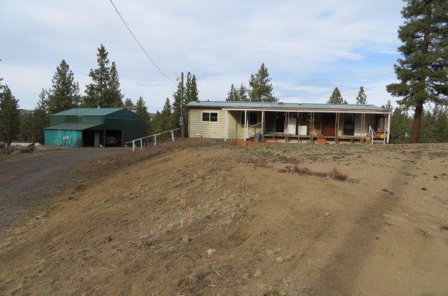 Very clean and welcoming is this 1979 mobile home 2.4 acres. 2 BR, 2B with deck and back porch built on. There is a metal shop/garage building also with a workshop inside. a pump house rounds this well cared for property.