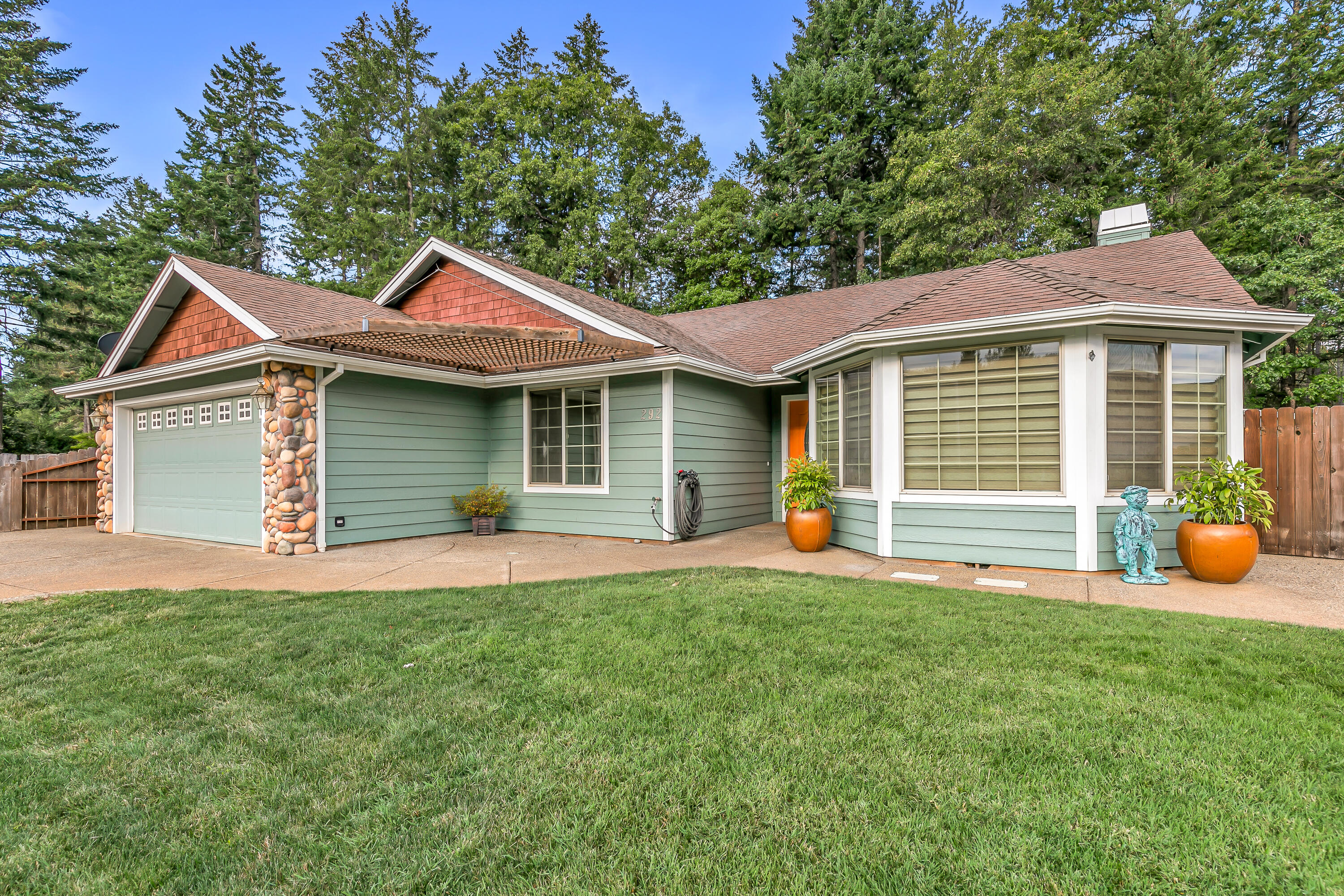 This immaculate 2005-built home has been beautifully refreshed with new interior paint, plush carpeting, & all new stainless-steel appliances! Offering 3 bedrooms & 2 baths, it's move-in ready with all the right updates. The fully permitted detached shop is a standout, featuring its own electrical panel, 220 power, & a cozy pellet stove—perfect for projects, hobbies, or extra storage. RV enthusiasts will love the dedicated parking & 220-volt hookups. Tucked away on a quiet street, the property backs up to a beautiful wooded area & is flanked by two vacant lots, creating extra privacy. Nestled in the heart of Southern Oregon's Illinois Valley, Cave Junction offers a peaceful, close-knit community surrounded by incredible outdoor recreation—just minutes to the Oregon Caves, scenic rivers, hiking trails, & an easy drive to the Oregon Coast or Grants Pass. A recently serviced HVAC, modern updates, & versatile living areas ensure comfort & functionality throughout the home. A must see!