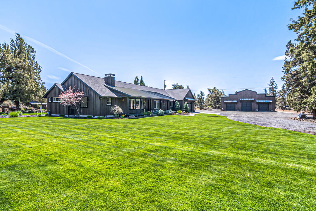 This custom 2,566sf home 4bed/2.5bath, office and bonus room. Wire brushed oak floors, stained hickory cabinets with solid surfaces. Vaulted ceilings in living room with floor to ceiling gas fireplace with built ins. Kitchen has double wall oven, cooktop with hickory hood, corner pantry, black leathered granite with full tile backsplash and under/over cabinet lighting.  Master bedroom has a walk in tile shower, heated tile floor, soaking tub, double vanity and separate toilet room. 2nd bath includes shower/ toilet in separate room, double vanity & large linen. Laundry w/extra cabinetry, quartz counters, full tile backsplash and sink. Built-in Vac, speakers throughout. Paver driveway, walkway & patio outback with pondless water feature, fire pit. Beautifully landscaped. Sprinkler system, horseshoe pit, play structures, treehouse, fenced raised bed garden with drip system, fruit trees, large shed/chicken coop w/fenced run. 4-h area. Heated Bunkhouse. Custom 3-bay shop to match home.