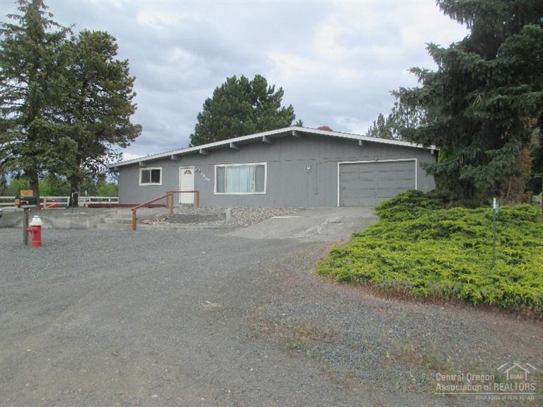 Live in the country with a great view of Mount Jefferson. Large living room, open kitchen and family room for wonderful family events.Newer windows throughout, newer furnace with heat pump, newer septic system, and newer front and back doors. Fireplace in the living room for those cold winter nights. Room for you and your children's 4-H or FFA projects. Nice double car garage attached.Covered deck in back for outdoor entertainment. Come and see this warm family home.Be the newer family to live here.