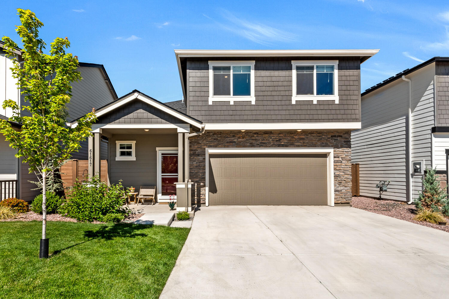Welcome home to this well cared for and lightly lived in four bedroom house in the quiet NW section of the Stone Creek neighborhood.  The open floor plan is anchored with the large kitchen island with solid surface countertops and extensive cabinetry throughout the kitchen.  Plenty of natural light on the main level with a sliding door to the back patio ideal for indoor outdoor living with a fenced yard area off the back patio.  Upstairs you'll find a generous sized primary suite, laundry room, a second full bathroom and three additional bedrooms. The home has central A/C for the summer months and a cozy gas fireplace for the winter season to stay comfortable year round. The attached two car garage provides plenty of storage options for your vehicles and Central Oregon gear.