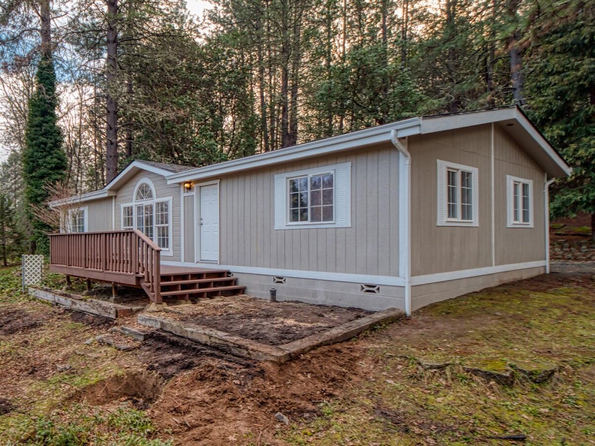 Open House this Sunday (2/6) from 11:00-2:00! Come see this completely redone 3-Bedroom/2-Bathroom manufactured home on a half-acre. Outside improvements include new exterior paint, new roof, new french drain and a new deck. Inside find a new kitchen with new cabinets, countertops and stainless steel appliances. Throughout the home is new paint, flooring and lighting all conditioned by a brand new HVAC system. Both bathrooms include new vanities, hardware and toilets and are serviced by a new water heater. Strong well at 12 GPM according to a 11/2021 flow test. Listing agent is related to seller. With low property taxes of only $956 per year this turn-key home won't last long!