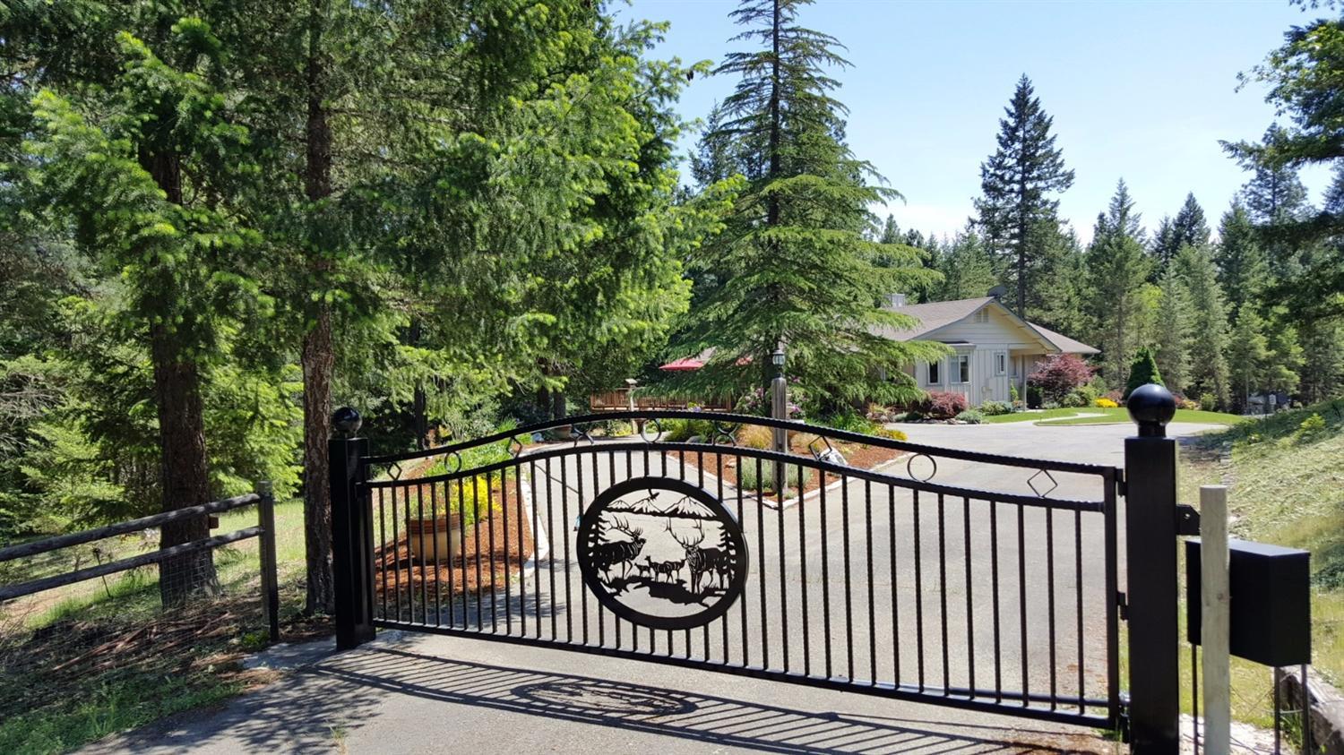 Welcome to Paradise and just 10 minutes from Grants Pass. Ashbrook Ln is a private street off of Cambridge. This nicely forested piece of property has something for all. Nice corner lot that is cross fenced and gated with two entrances for a total drive-thru experience. Seasonal creek, large over-sized, covered shop with RV doors, power and extra storage on side and behind. RV parking, boat parking, lots of parking and the house is surrounded by lush green lawns, beautiful landscaping with your treed setting. Enjoy the deck and beautiful views right off the living room and front door. Open living room with wood beams, energy efficient wood stove and heat pump. Large open kitchen with granite, lots of cupboard space and two ovens. Large master bedroom with bath. Landscaping all on drips and sprinklers and the forested property even has sprinklers throughout as well. Nice setup and you won't be disappointed. Call to see this private home today. Appointment only to view. All information d