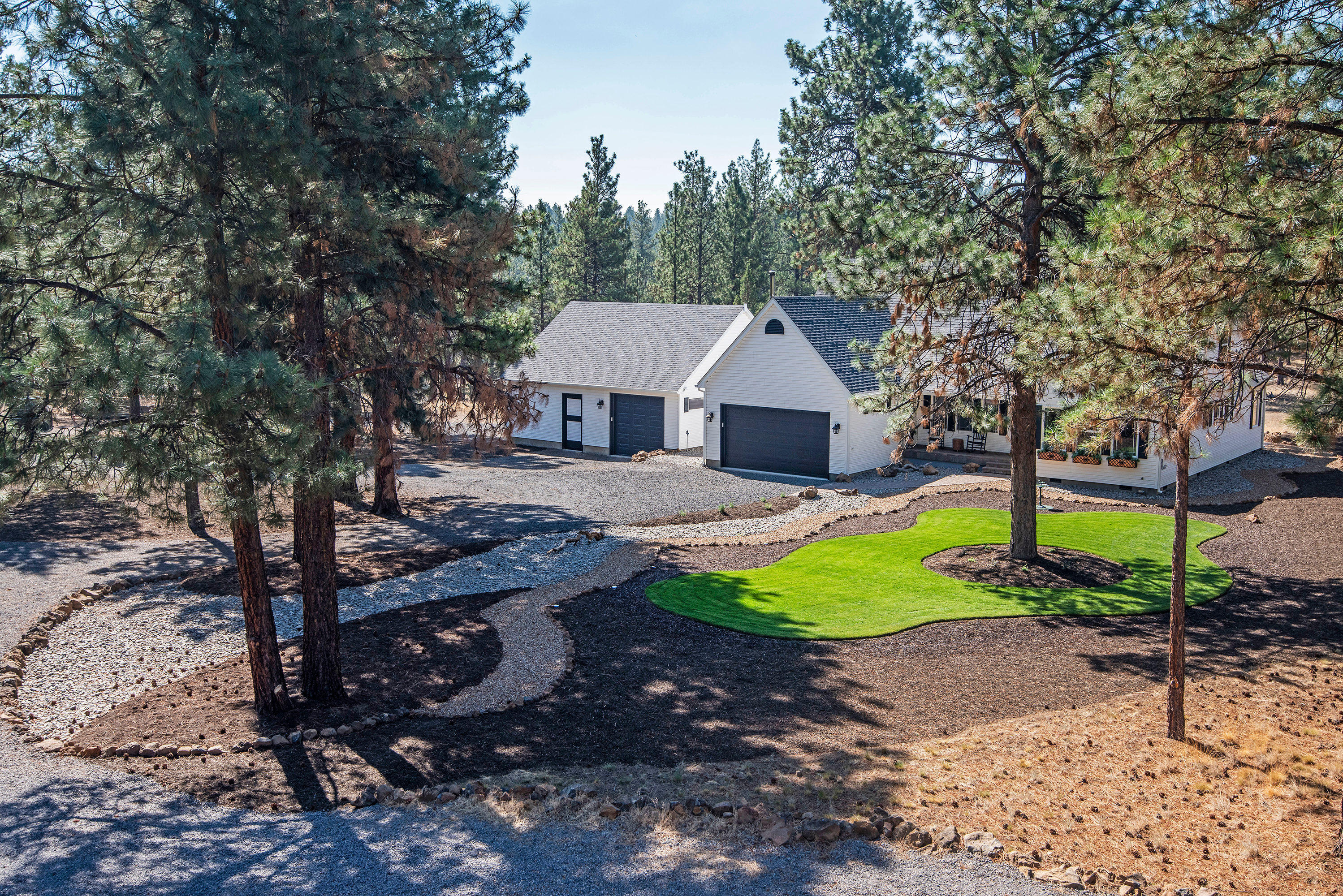 Complete Privacy on over 40 acres of forested land that backs up to public lands. Brand New 5,500 sq.ft. 3 Bay shop with 4 RV Garage Doors and a Large heated & air conditioned office, 72'' remote ceiling fans, LED lighting throughout - this shop must be seen to believe!  And it's beautiful with a balcony that looks over the property! The Country Farm House is 2,273 sq.ft. with 4 bedrooms and 2 1/2 baths.  The house has been completely updated with new appliances and washer & dryer. The exterior has been freshly painted.  Long 3/4 of a mile winding driveway - this setting is like something out of a movie. 2 car attached garage with additional 1 car attached garage. Huge back patio looks out over a meadow and forest to view the wildlife that live there. Quiet and serene yet only 10 miles to the quaint town of Sisters, Oregon. This property is just what you've been looking for!