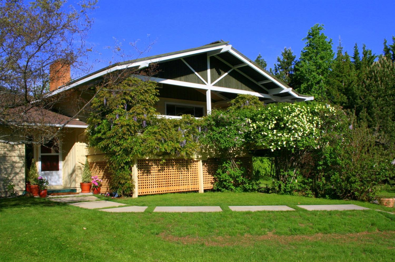 Enjoy your new home in the country! Located in Sunny Oaks (rural neighborhood of million dollar homes) just a stone's throw from Emigrant Lake and less than 10 mins to town. Set back off the road, this property offers 2.81 park like acres with spectacular lake, pasture and mountain views. Well cared for home offers 2946 SF, 3 bdrms, 2 full baths w/ optional 4th bdrm & half bath with private entry, a large country kitchen w/ lots of extra cabinet space, a light filled Liv. Rm. with beautiful stone fireplace and custom cedar wood ceiling, large family room downstairs & a huge wrap around upper deck w/custom awning. Outbuildings; 420 sf art studio, garden shed & 50' x 65' multi -purpose shop w/ 110-220 power w/ under roof RV space. Beautiful lawns, fruit trees, a mix of pines & fir trees, willows & flowering plants, shrubs & wild flowers all w/ irrigation rights & systems irrigated landscaping. Perfect for a home business too. Seller is licensed Oregon Real Estate broker.