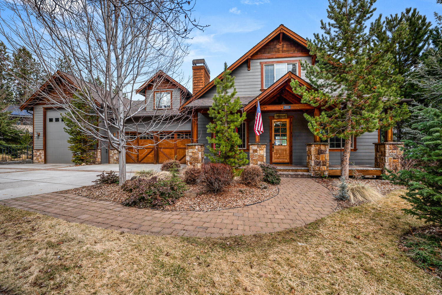 Absolutely stunning two-story custom home with a massive RV garage in Shevlin Ridge on Bend's sought-after Westside. Open great room floor plan with beautiful character-grade maple wood floors and a cozy gas fireplace that seamlessly flows into a gourmet island kitchen with slab granite countertops, stainless steel appliances, alder cabinetry, and both formal and informal dining areas. Spacious main level primary suite with hardwood floors, a gas fireplace, and a luxurious private bath with a jetted tub, tiled shower, and more. The upper level boasts a huge bonus room with a wet bar, beverage fridge, and a full bath. Nearly 1900 sqft of garage space, including an oversized RV bay with epoxy floors—perfect for outdoor enthusiasts and their gear. Situated on a park-like .31-acre lot with mature landscaping, fenced back and side yards, and a paver patio are ideal for entertaining. Conveniently located near trails, schools, shops, and restaurants. Call your broker for a private tour today