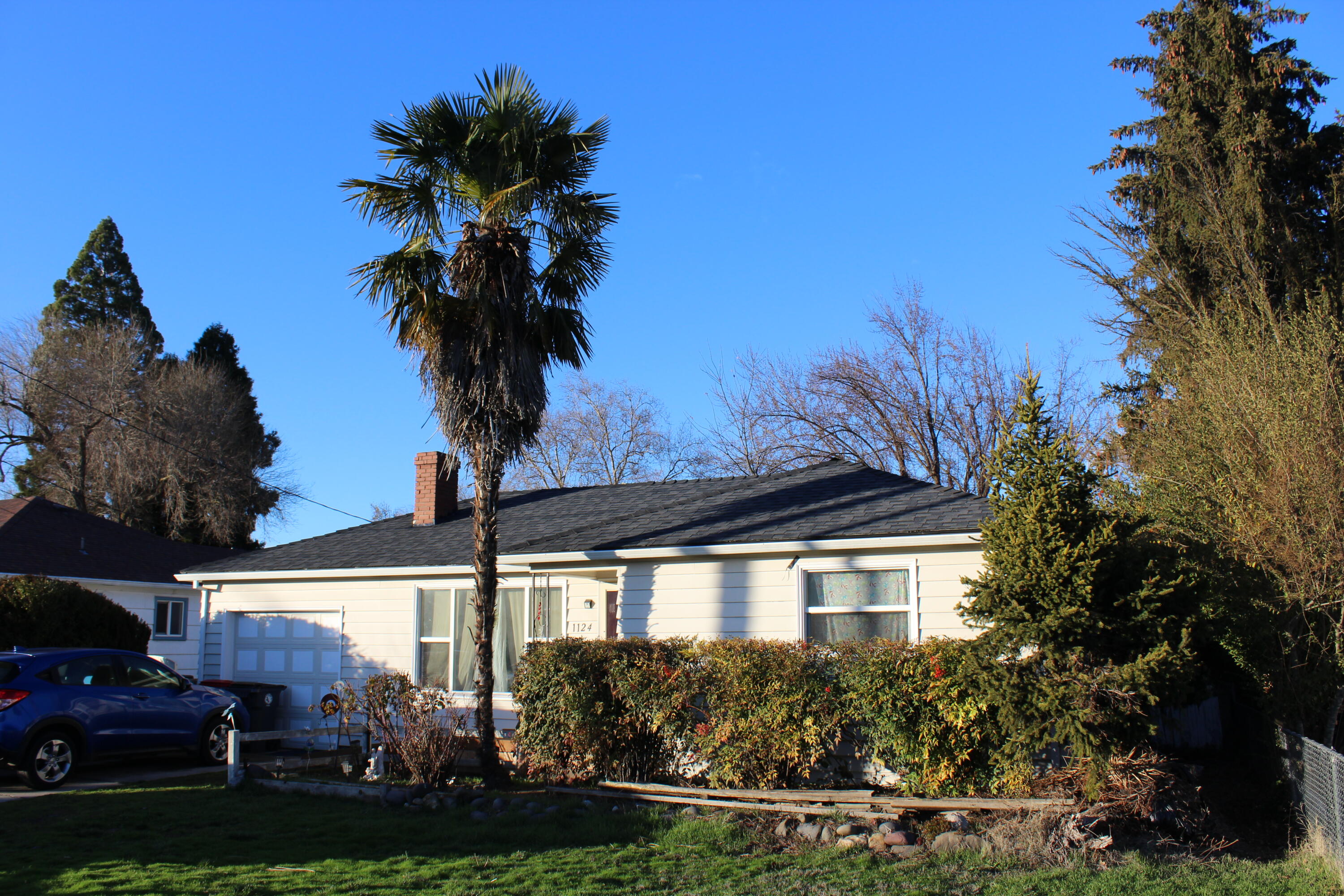 Cute smaller home, great location, oak hardwood floors, fireplace with woodstove, newer vinyl insulated windows, handicap accessible ramp, heating and air, single car attached, covered patio, separate 1-car garage/shop, attached greenhouse, alley access.