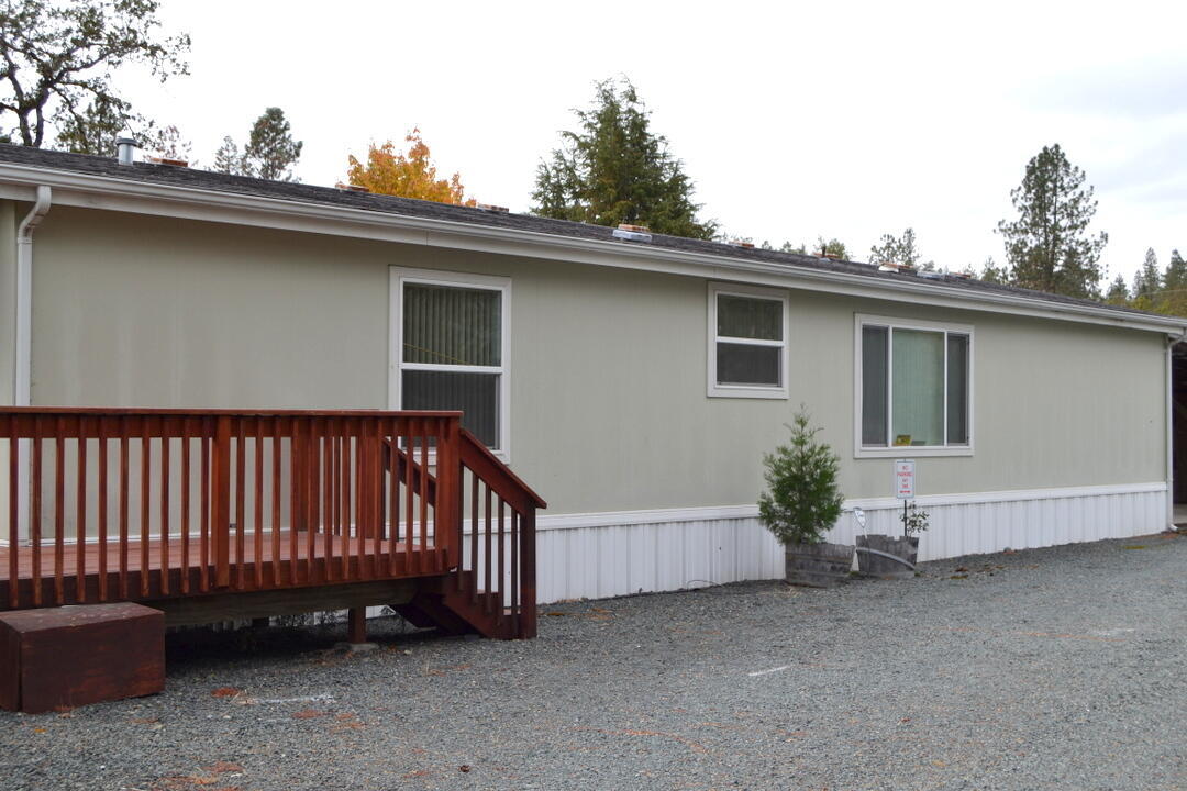 Awesome Location! Nice immaculate manufactured home built in 2004, in nice, rented space with reasonable space rent, that includes water, sewer, & garbage, only 12 spaces in Park.  This spacious double-wide features vaulted ceilings, open floor plan, spacious kitchen has an island and eating bar, lots of cabinets, all appliances including washer and dryer, dining area and breakfast nook, primary bedroom has walk-in closet, soaking tub & shower, with extra space can be office or reading/tv den, Nice covered deck to enjoy nature and wildlife, covered carport and shed for storage, fruit trees and drip, located in peaceful area close to the Rogue River.