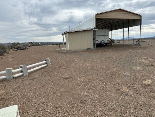Welcome to your perfect slice of high desert paradise! This .35-acre corner lot offers an incredible opportunity for those seeking space, convenience, and natural beauty. Situated on a prime corner with paved road on one side, this residential property is ready for your dreams to take shape. It already has power, water, and septic system installed, saving you the time and cost of development.
The property features an RV cover to protect your recreational vehicle from the elements, along with additional storage structures—ideal for keeping your gear and tools  secure. Whether you're looking for a vacation retreat,  or even just a weekend getaway, this lot has the flexibility to fit your needs.
Conveniently located just a short drive from Christmas Valley, you'll have easy access to groceries, gas, supplies, and local dining. For recreation, you can play a round of golf at the Christmas Valley Golf Course, or head out to the nearby sand dunes for off-road fun and adventure. The area