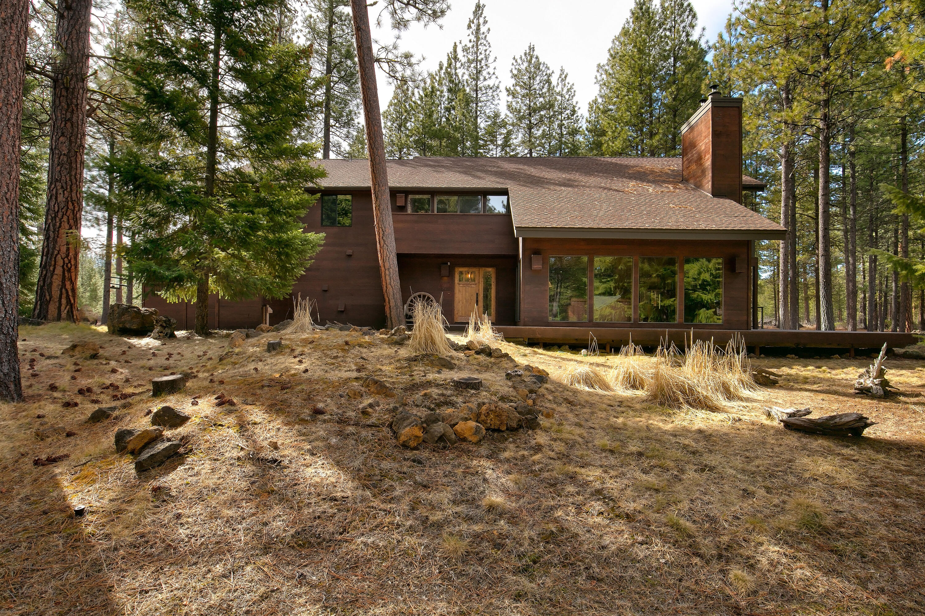 Explore this exceptional property in Black Butte Ranch, nestled next to Deschutes National Forest and close to the Glaze Meadow Recreation Center. Spanning 5,299 square feet and on 1.68 acres, this home includes four bedrooms, two living areas, and a spacious deck with a new hot tub, ideal for entertaining! The main level features great room with a wood-burning fireplace, a bedroom with an en-suite bathroom, and a kitchen that flows into the dining area with wet bar and wine fridge. The lower level offers a second living space, a full bathroom, and plenty of storage. Upstairs, you'll find a large bunk room, a third bedroom with deck access, and the primary suite, which includes an en-suite bathroom with double vanity and a walk-in shower. SM 208 is the perfect home for full-time living, second home, or vacation rental. Come see this special property today!