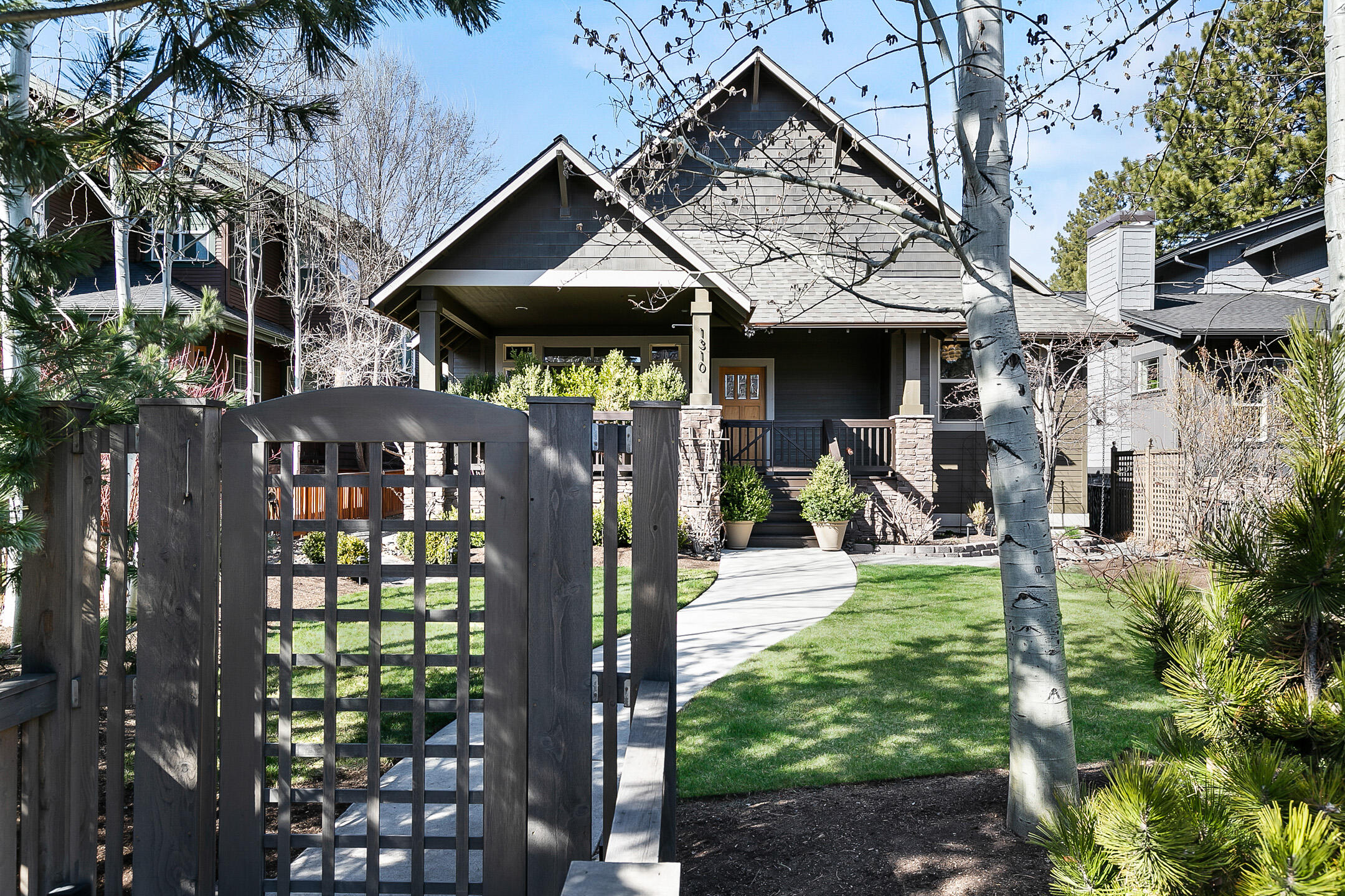 This Spectacular single level Pacific NW custom home is a contemporary masterpiece! Showcasing time honored features which include an open floor plan that flows seamlessly between the living, dining and kitchen, french doors opening to serene outdoor spaces, Chef's kitchen with a 6 burner Wolf stove and double ovens, huge center island and additional eating bar, solid Black Walnut hardwood floors, floor to ceiling concrete fireplace, artisanal powder room, whole house water filtration system and much more. Included in this stunning property is a thoughtfully designed ADU with vaulted ceilings, kitchen island, heated bathroom floor, ductless heating & cooling and the smartest use of space ever!  The exterior is breathtaking, with multiple outdoor living spaces that all join in perfect harmony, lovely fruit bearing trees and berry bushes, flowers galore and one dream Garden Shed. This is a fantastic one of a kind home, 1/2 block to Newport Market, and a 15 minute walk to downtown Bend