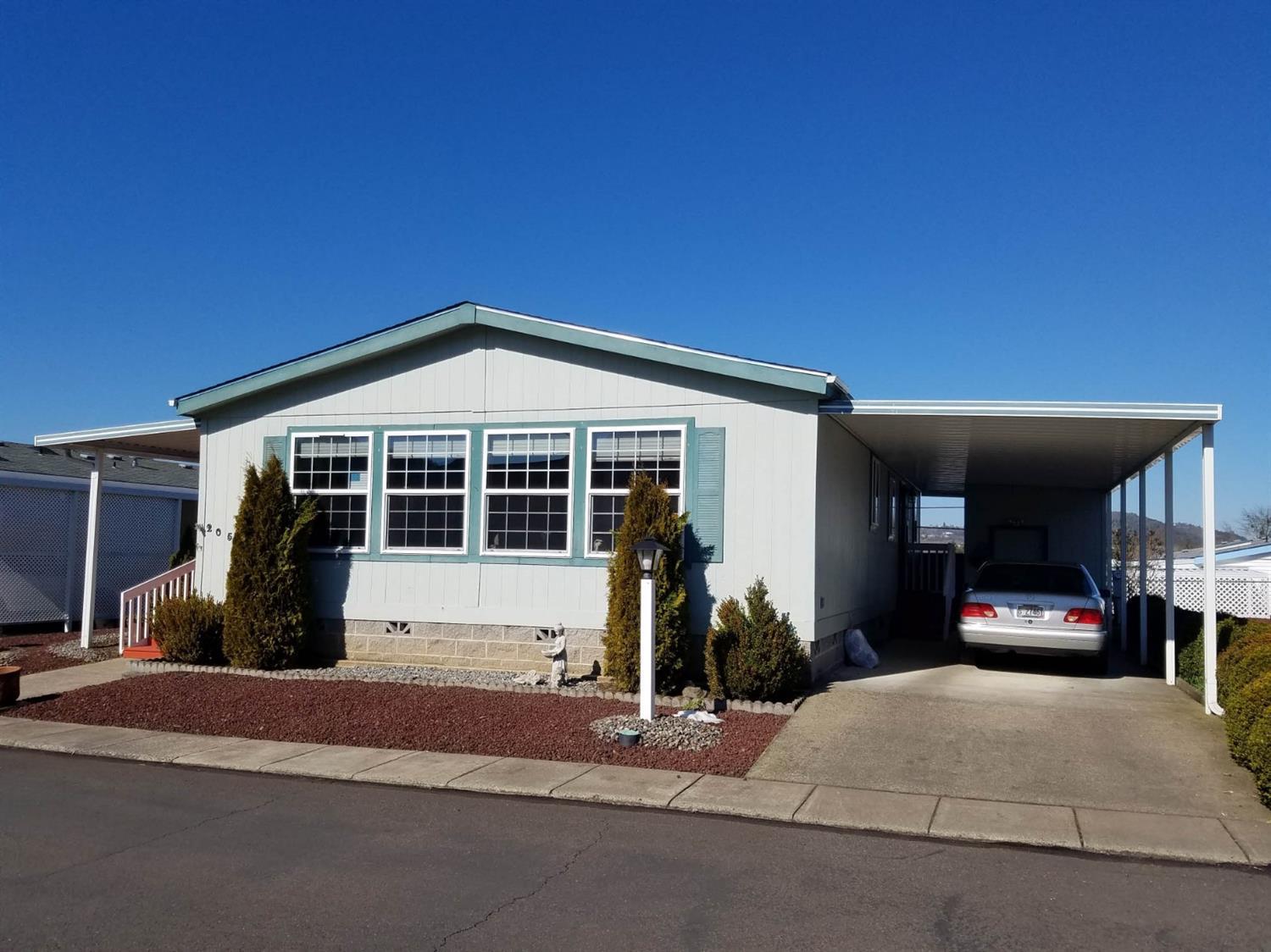 Immaculate (inside & out) manufactured home with all the extras in a nice, well maintained park! Close to shopping, freeway, medical facilities Easy care front & fenced (5 FT) back yard! This well cared for 2br/2 FULL ba spacious home features vaulted ceilings, skylights, built-ins galore, big windows, walk-in closets, stamped concrete patio, spacious covered deck, firepit, storage shed, New roof, Laminate, exterior paint, toilets, hot water heater, vanity,ceiling fans & Too much to list! Sale includes ALL appliances. This home is ready for its new owners! PRICED TO SELL! Make this Impressive Dreamhome yours! Call now for a personal tour!