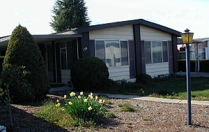 Best buy in Bear Lake 55+ park! Won't last. Owner has moved to assisted living - children will have her personal belongings out by April 20. Ignore the mess and show this great triple-wide home. Newer carpeting, vinyl, water heater, air conditioning, great floor plan, vaulted ceilings. A must see. Show and sell. Keybox on back door.