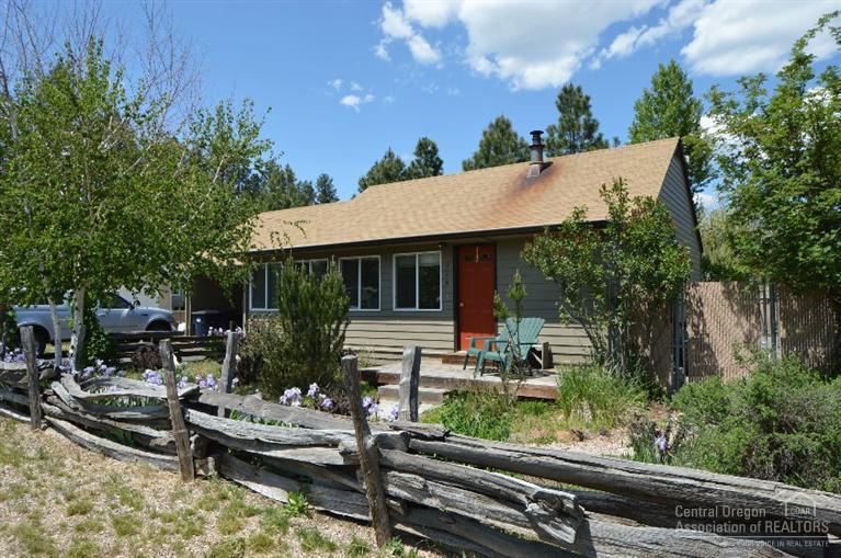 Live, work & play in Town! Sisters's living at it's best with this updated 978 sq.ft. cottage in the heart of Sisters Country. Spacious lot, room to build garage structure and expand living space. Complete with storage shed with work bench and garden/chicken house. Wildflowers flourish with sprinkler system front and rear. Fenced back yard, RV area, six raised beds with drip system & more. Close to trails, creek, parks, shopping, restaurants & Elementary School.