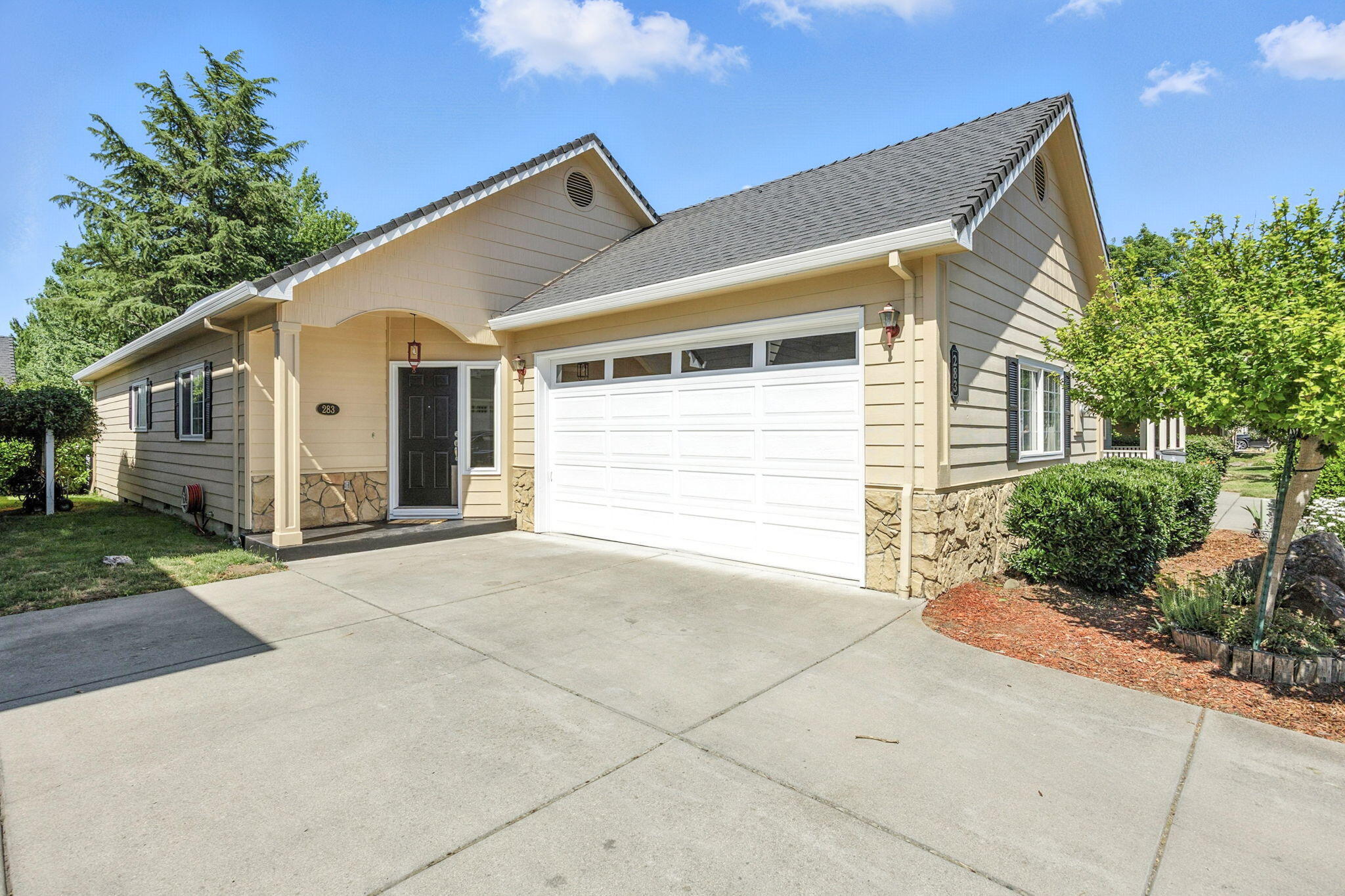 Charming single-level home backing to open space and a serene creek in South Ashland. This inviting home features vaulted ceilings, a skylight for natural light, and warm oak floors throughout. The spacious kitchen includes stainless appliances and a handcrafted redwood breakfast bar. A cozy gas fireplace anchors the living room, which opens to a private patio—perfect for morning coffee with peaceful green space views. Two generously sized bedrooms each have their own sink and toilet, sharing a Jack-and-Jill bath with a large jetted tub and walk-in shower. One of the few single-level homes in the subdivision, this property enjoys one of the best vantage points with straight-line views of the open space. Located near the YMCA, bike path and shops of south Ashland. Don't miss your opportunity to view this home!