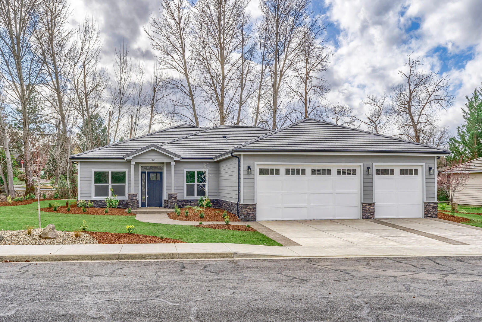 New construction in the beautiful golf community of Eagle Point. The wood floors, and coffered, high ceiling create a timeless interior. Counter tops are quartz and leathered granite and top off the custom cabinets beautifully. All new black stainless steel Samsung appliances in the kitchen and a motion activated kitchen faucet. Abundant storage with walk-in pantry, laundry room cabinets and a perfect built-in at the entry. Owner's suite features a large walk-in closet and walk-out french doors. This masterful floorplan checks off privacy needs and spaces for gatherings. The covered patio is perfect for taking in the scenery of the creek and is plumbed for gas barbecue. The home is situated conveniently next to a walking path and is surrounded with remarkable views.