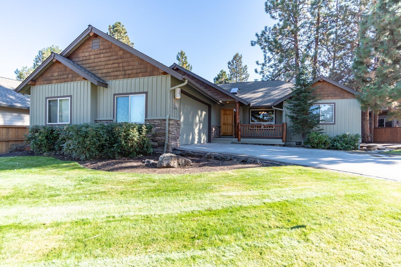 Beautiful custom Schumacher Construction Single level in Pride of ownership Mountain Pines which adjoins the 5th hole of the Bend Golf and Country Club. Easy access to the clubhouse via with your golf cart in the neighborhood. 3 bedrooms, 2 baths. 1620 square feet which lives much larger than its square footage. Log accents and knotty pine ceiling at the kitchen and great room with knotty pine wainscoating in the great room. Great separation of master suite and additional two bedrooms. Stainless steel appliances and pullout draws in the kitchen with an oversized refrigerator. 14 foot breakfast bar with room for six stools. Two pantries and storage galore! Built-in entertainment center in the great room with a massive rock fireplace with gas insert. Slate stone flooring throughout with carpet Oversized 2+ car garage with pull down storage. Welcoming front porch. Large paver patio in the backyard with an easily maintained yard. A/C! Close and convenient to everyth