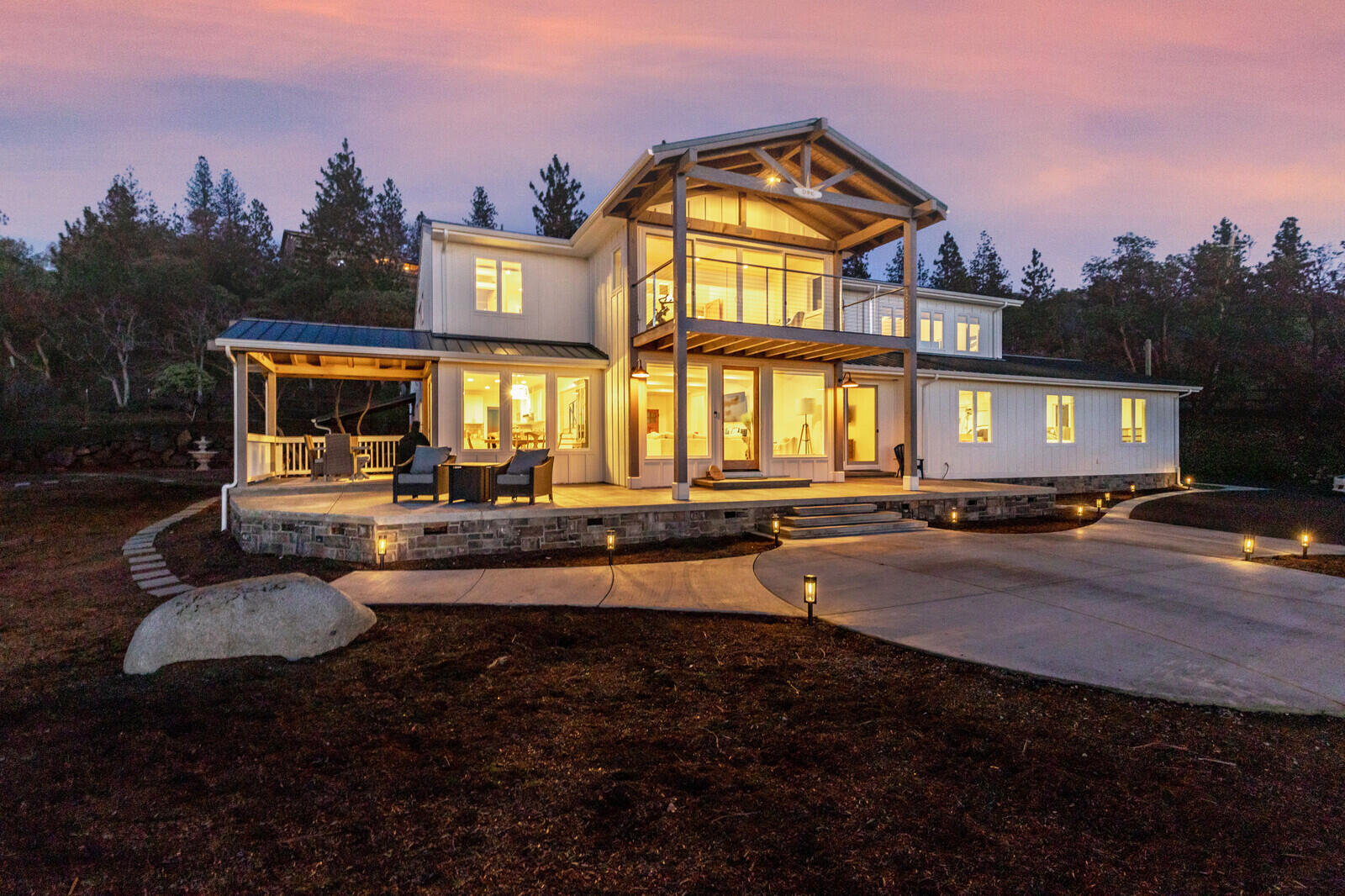 Fabulous Modern Farmhouse on 2.87 acres in desirable Sun Ridge Estates.  Endless views of surrounding mountains, stunning sunsets and city lights.  This amazing home features 3656 sf of  luxurious living space, an 1100 sf attached shop with half bath plus a 2 car garage.  The main level features an open beam ceiling with expansive windows and an abundance of natural light, a newly remodeled kitchen with white shaker cabinetry, quartz countertops & stainless appliances.  The main level also includes a spacious bedroom with a fabulous full bath plus large guest quarters with private entrance.  The upper level features a  master suite with  amazing views from the floor to ceiling windows plus a patio to enjoy gorgeous sunsets, a spa bath with walk in closet and plenty of built-in-storage. an office separates the master suite from the spacious additional bedroom with vaulted beam ceiling.  There is a roof top sun deck,  detached yoga studio, paved and gated drive and so much more...