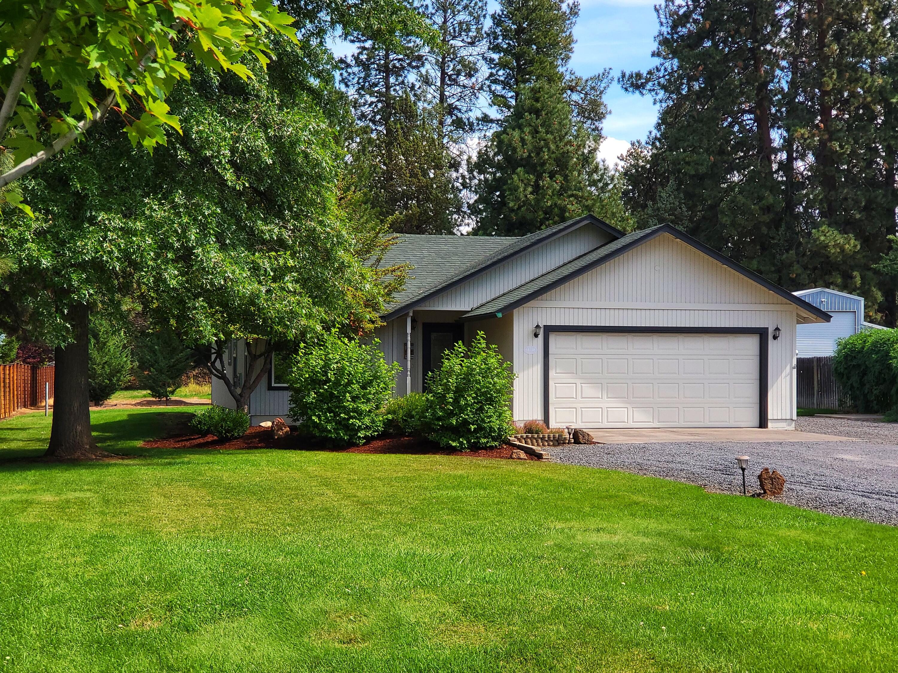 Live the Bend, Oregon dream from this perfectly located cutie! Private and peaceful .62 acres near the Old Mill and above Riverbend Park! Head out the back door to the canal trail and wander to the Deschutes River Trail with easy access to concerts, coffee shops, eateries and more. The darling 2 bedroom 2 bathroom home was lovingly updated in 2017 with new windows, solid core doors, new trim, flooring, interior and exterior paint and a new furnace and AC unit. The beautiful kitchen with center island, stainless steel appliances and lots of natural light is a dream for any chef. Cozy up by the gas fireplace or have a soak in the  hot tub as you watch wildlife play near the pond in your private oasis! Whether you seek privacy or want a place to garden, this big lot with irrigation and a pond is a rare find in the heart of Bend. There is a 2 car attached garage and plenty of room for RV and toys. Potential to expand home / add ADU.