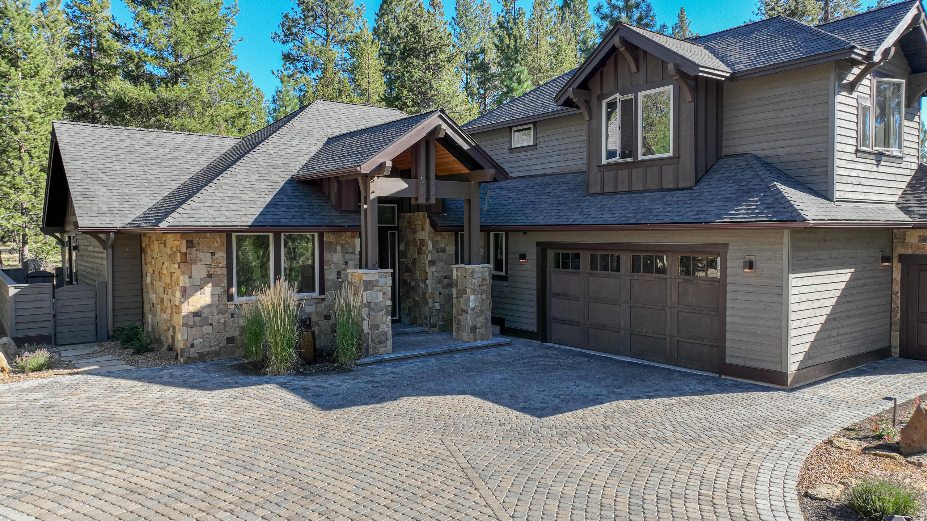 Nestled among the stunning natural beauty of the pines, live your dream in this custom NW craftsman style design by the premier luxury homebuilder Olsen Brothers Construction. Tastefully appointed with high-end finishes including massive wood beams, hickory wood floors, custom cabinetry, rich woods, solid surfaces. The main floor features 2 bedrooms with full ensuites including the primary, spacious efficent working office, Great room, kitchen includes Samsung stainless appliances, dining area, laundry, and powder bath. Upstairs features 1 bedroom, full bath, and private bunkroom. Artfully landscaped, fully irrigated including  water feature out front, and paver driveway with added parking. Cat 6 wired and Sonos sound system throughout. Ring secuirty system including doorbell. Fleit electric programmable lighting. Private hot tub off the Master. Built in dog run. STR allowed. Caldera Springs offers proximity to world-class outdoor recreation. Let this be your life! Call today