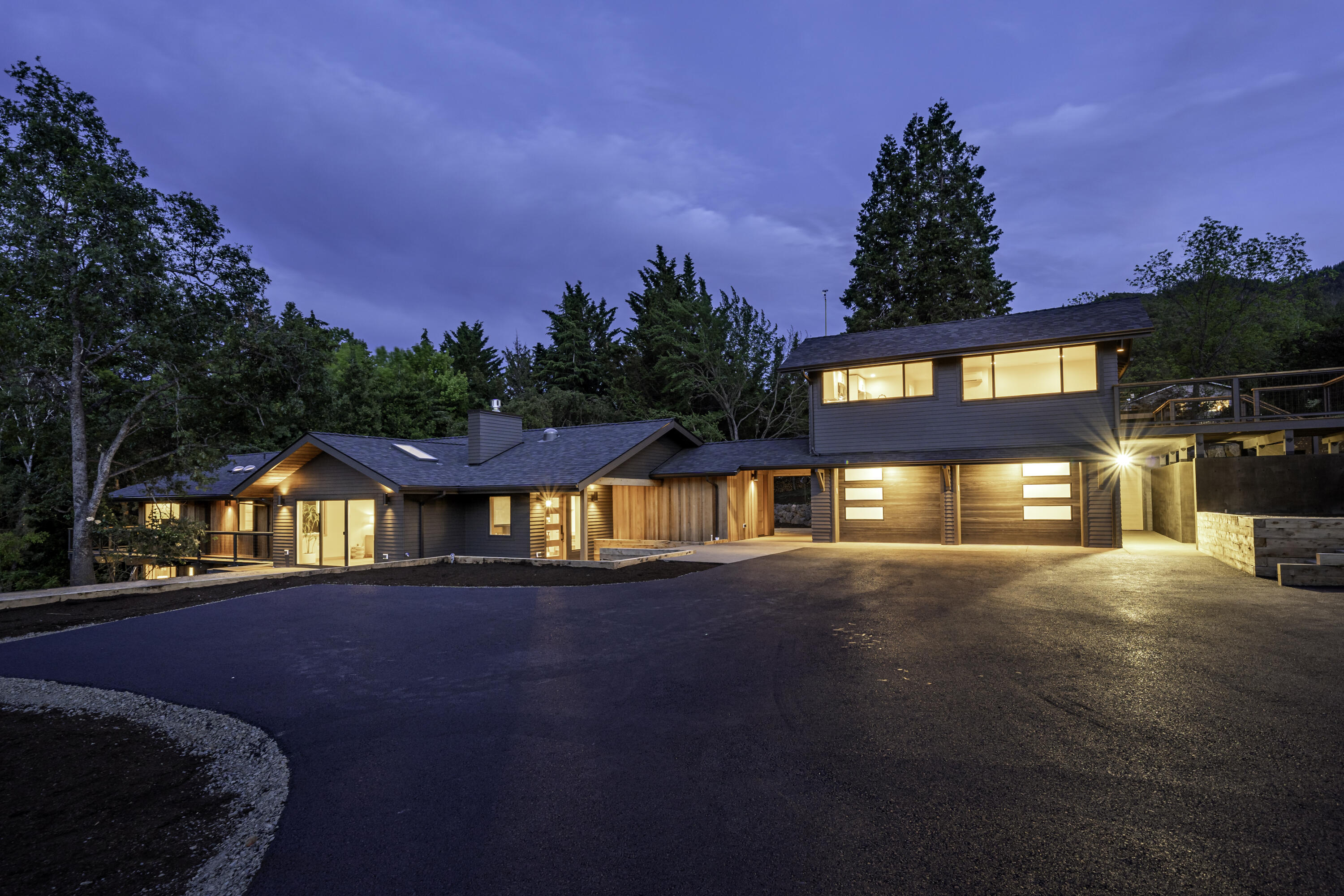 One-of-a-kind estate with two mid century residences thoroughly remodeled by renowned local architect Carlos Delgado and Mark Lackey of Integrity Building Contractors. Exceptionally rare two-acre parcel includes over 300+ feet of Paradise Creek frontage with massive granite boulders, mature trees, orchard, and gently sloping pasture with barn and stables. For an integrated experience with the outdoors, residences feature walls of glass doors and windows, sustainable hardwood decks, and expansive poured concrete patios with both Northern and Southern exposure. The main home's interior features wide-plank white oak floors, artisan tilework, cherry cabinetry and built-in shelving, open-concept great room and gourmet kitchen, along with a luxurious and spacious primary suite — all with designer fixtures and hardware throughout. Guest apartment (ADU) complete with kitchen and living area, bedroom, full bathroom and laundry. Inquire for details of construction and development potential!