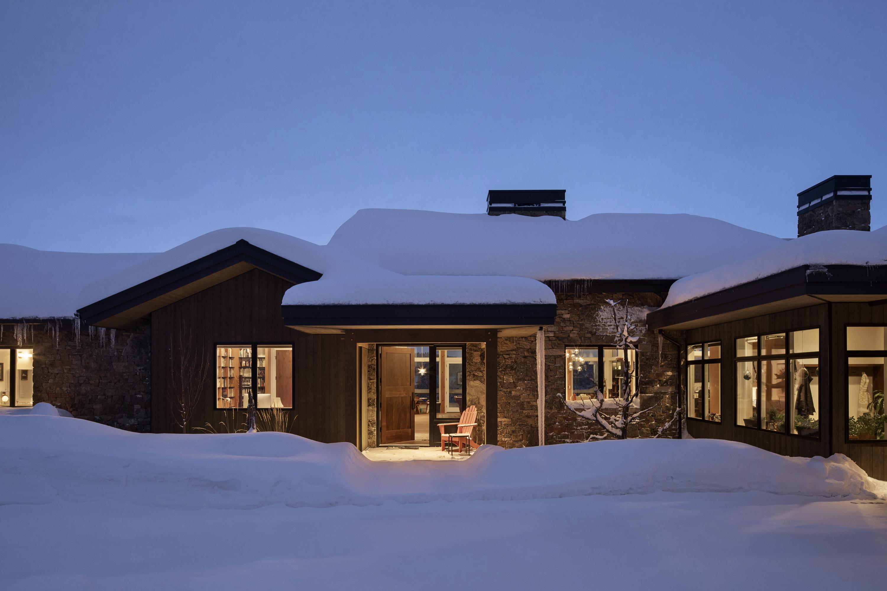 Stunning Cascade Mountain views from Mt. Bachelor to Mt. Jefferson frame this ''Old Stone Modern'' home's setting in a remote corner of North Rim, offering privacy and a low-maintenance high desert landscape that will draw you home again and again.  The interior has a welcoming, cozy feel, with modern touches at every turn.  Timber framing and a double-sided Montana moss stone fireplace form the heart of the home and contemporary and clean finishes balance the heavy timber and rock. Douglas Fir cabinetry and Claro Walnut windowsills finish telling the story of this Pacific Northwest retreat home.  The main floor's open floor plan makes for great entertaining with family and friends year-round - inside or out, and the downstairs offers flexibility as a family member's own apartment or a teenager's dream.  Built for aging in place, the design also exceeds both Earth Advantage and Energy Star environmental standards.  With a timeless style and contemporary bones, this home lives well.