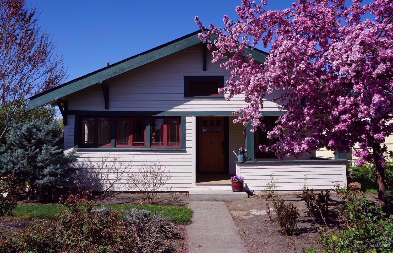 Classic 1920's Craftsman bungalow just a few blocks from historic downtown Redmond. Beautifully renovated to retain its charm, yet tastefully updated. The old wood floors have been restored, while the kitchen comes with stainless appliances, solid surface counters and a country sink. Leaded glass, double-hung windows, and a delightful sunroom with French doors inside. Outside, enjoy the patio and garden.Fully fenced with sprinklers and drip system. Even a vintage garage used for a car or shop.