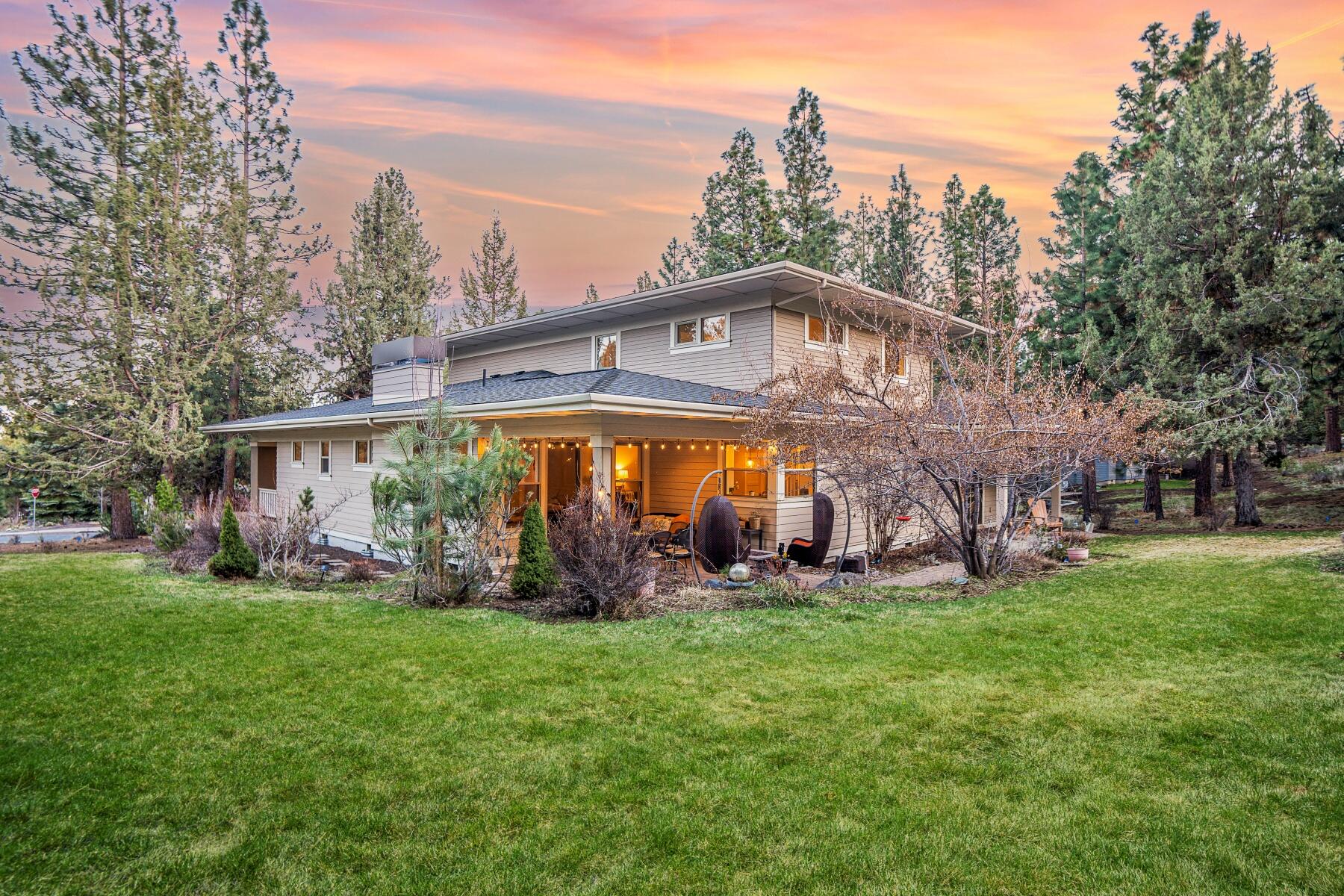 Tucked among the pines in a tranquil cul-de-sac on Awbrey Butte, this Greg Welch home offers both luxury and comfort, making it an ideal retreat for discerning homeowners. Inside, find an open floor plan filled with natural light and anchored by a cozy fireplace. The gourmet kitchen, featuring top-of-the-line appliances, custom cabinetry, sleek countertops, and a corner pantry, opens to a dining area with room for a crowd. The home boasts four bedrooms, including a first floor primary suite, complete with a spa-like bathroom and walk-in closet. Upstairs, find a sunny loft perfect for remote work or creative pursuits, as well as three bedrooms and a well-designed shared bath. Outside, the well-maintained grounds include a serene outdoor living space, complete with a patio, fire pit, and garden, ideal for alfresco dining and entertaining. Situated in one of Bend's most sought-after neighborhoods and within top-rated school boundaries, this home is not to be missed.