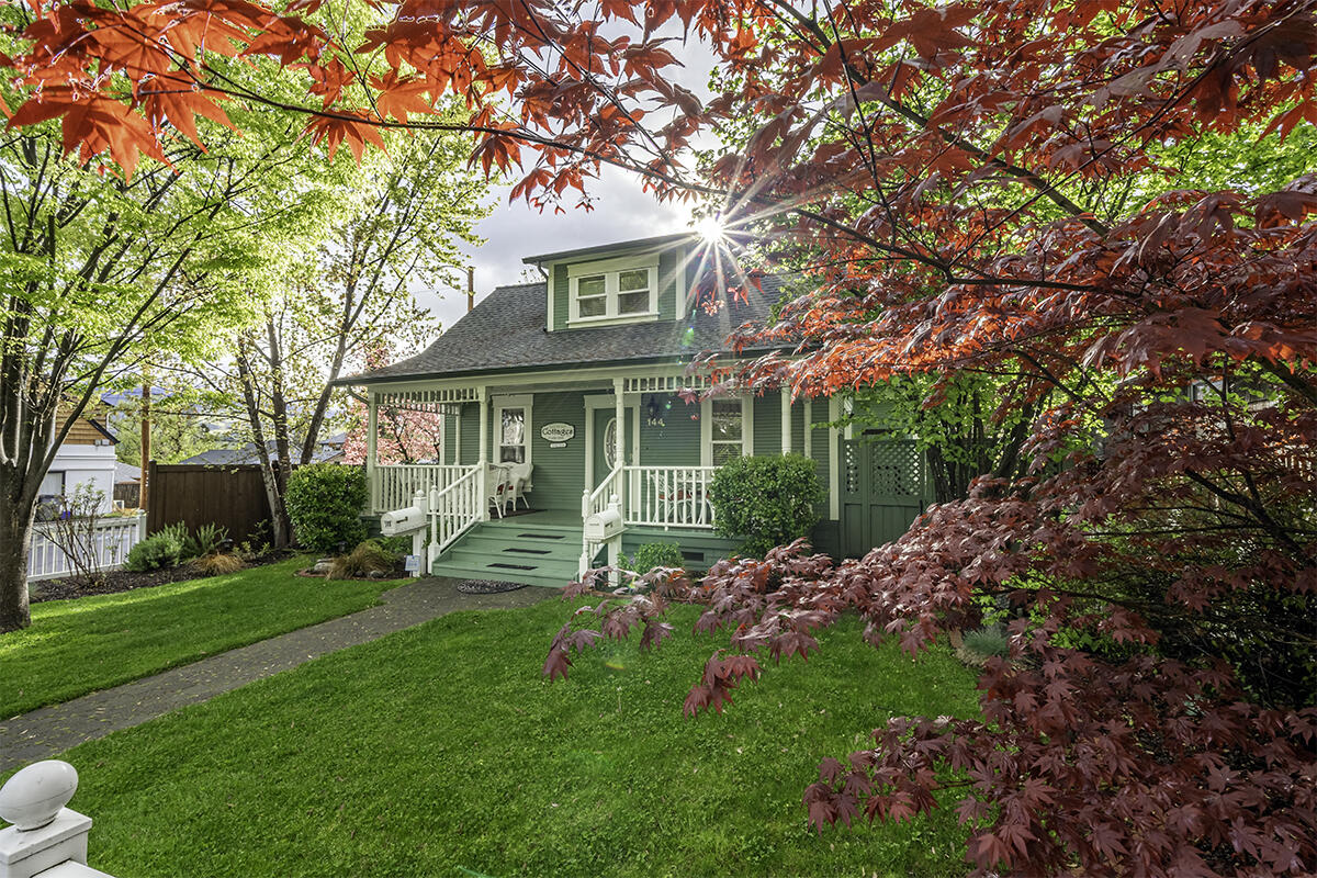Three units with median gross receipts over $100,000 per year in Ashland's Railroad District! The charming and thoroughly updated Second Street Cottages feature two furnished and permitted vacation rentals along with a spacious and comfortable owner's suite — each with full kitchen, central air conditioning, gas furnace and water heater, separate laundry facilities, double-paned windows and sliding glass doors to private fenced and gated outdoor spaces. Heritage House has four bedrooms and three full baths, large front porch, original fir floors, and operable Velux skylights. Garden Cottage has two bedrooms and two full baths, vaulted ceilings, oak floors, quartz and granite counters, and new kitchen appliances. The owner's Hideaway Suite has two separate exterior entrances, full main-level bath, office or formal dining, pantry, upper-level bedroom with full ensuite bath and ample closet storage. Accommodations featured on top booking sites in Ashland. Inquire for details!