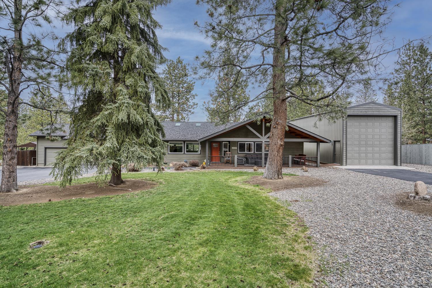 Exquisitely remodeled single-level home in desirable Woodside Ranch. 4 bedrooms, 2 bathrooms, primary on the main, bonus room above the large 3-car 
garage. One bedroom is currently being used as an office. Environmentally friendly, all electric heating and cooling systems with new wiring throughout. Light and airy design with skylights and open living areas. Spacious modern kitchen, stainless steel appliances, granite counter tops and hardwood floors.
Gorgeous views from the new TimberTech deck in back with large, retractable awning. Custom TimberTech covered front porch and spacious entry way.
Professionally landscaped and terraced 1.07 acre lot with large pine trees, gorgeous lawns front and rear. Fenced yard backs to a lovely seasonal irrigation
canal. Plenty of parking with a boat storage and a separate large insulated RV garage with its own driveway. This home is in immaculate condition throughout, you will not want to miss this rare find in Woodside Ranch!