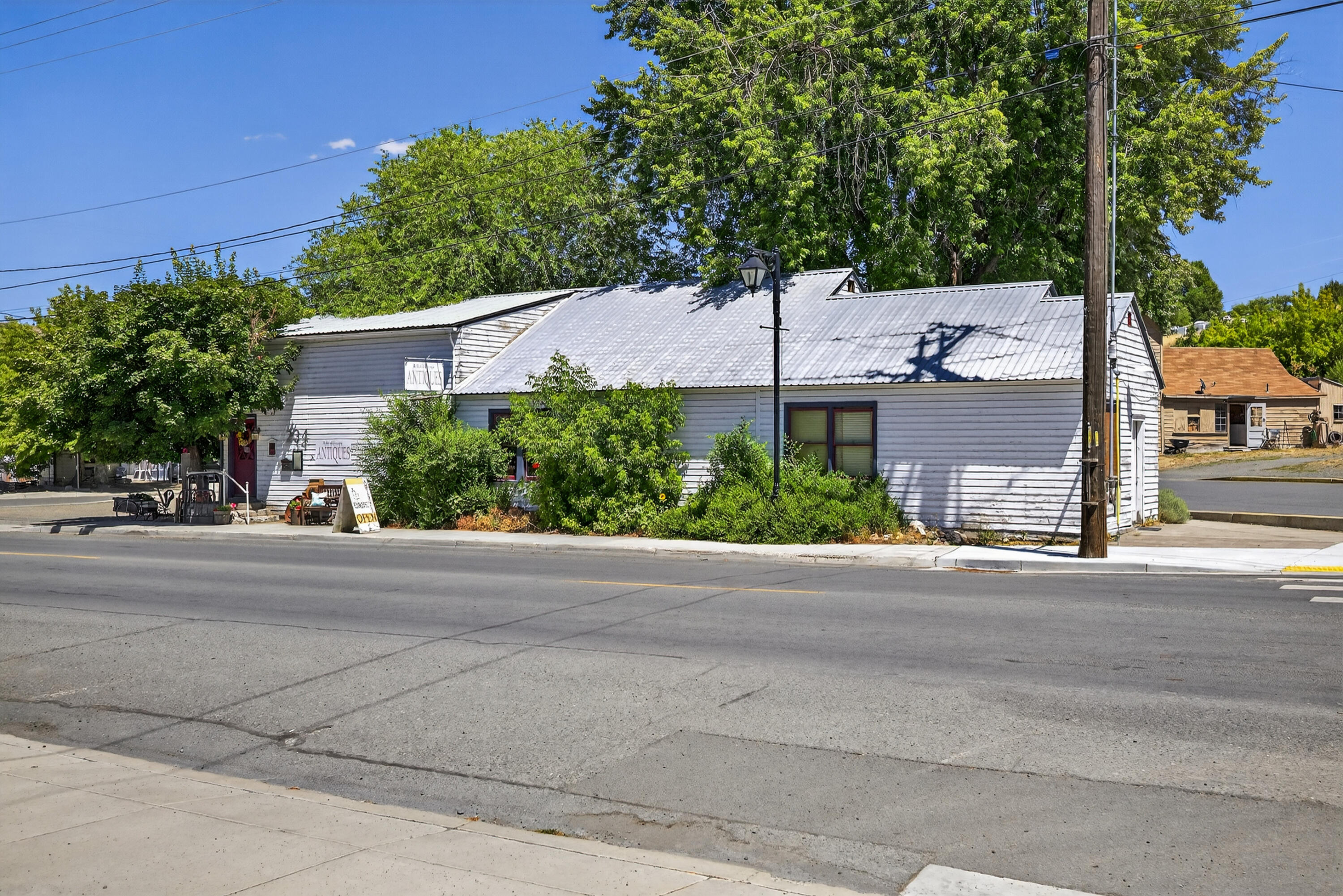 Discover the charm of a historic commercial building nestled in a prime location, perfect for a variety of business ventures. This property seamlessly combines the allure of the past with the functionality required for modern enterprises. Currently operating as a thriving antique store, empty lot is being used as a food truck court (lot size 0.13) it offers a unique opportunity for entrepreneurs looking to invest in a property with rich history and vibrant potential. Both Tax lots sold together.
