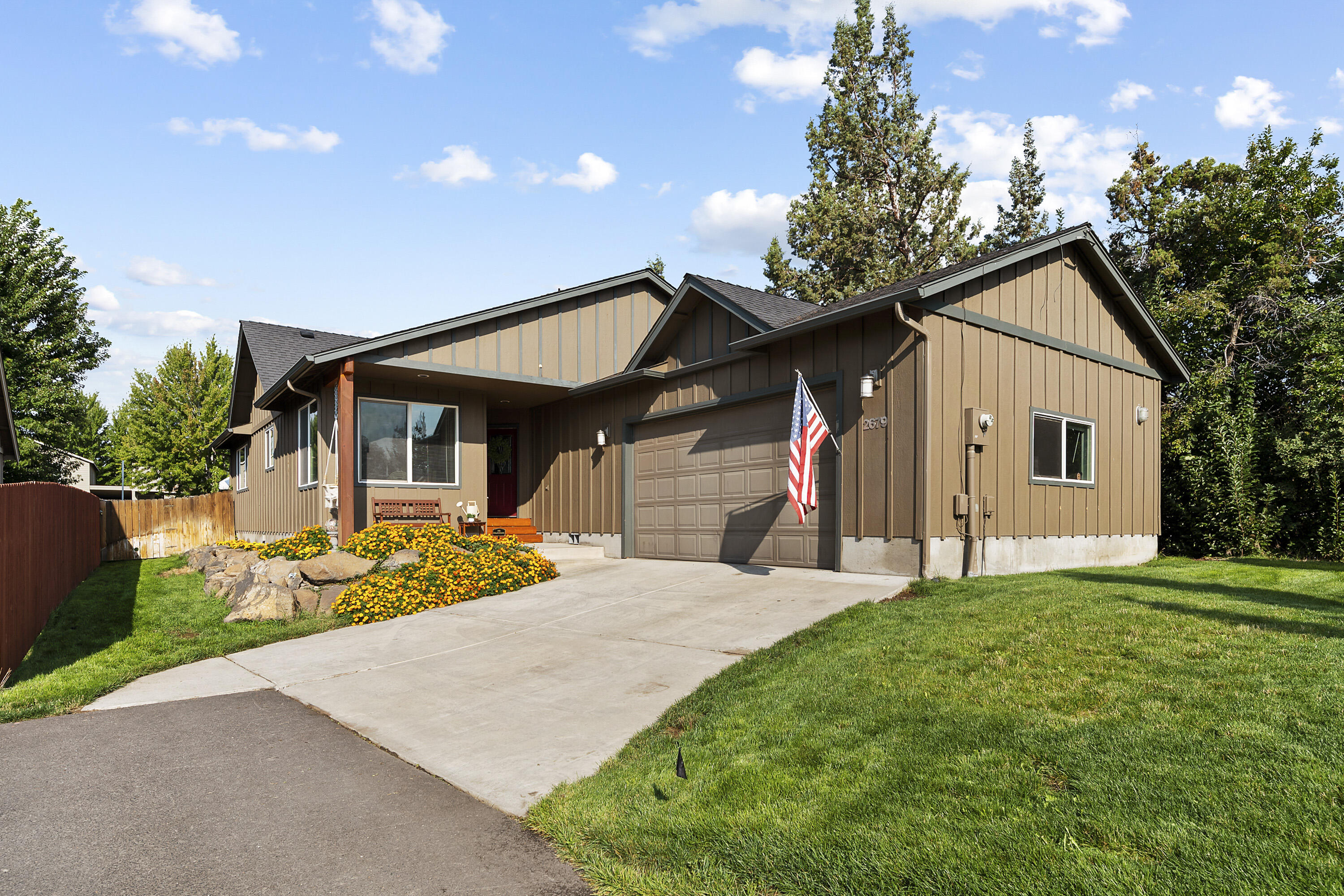 This beautiful home boasts warm finishes and an inviting floor plan. The breakfast nook is bright, the kitchen opens to the vaulted living room, and the bedrooms are large. Some of the custom features include granite tile counters, tile and carpet flooring and stainless steel appliances. The backyard is fully fenced and near the front of the home is a greenhouse. This property is fully landscaped and located in Southwest Redmond, just a short distance from Umatilla Sports Complex and numerous shopping opportunities.