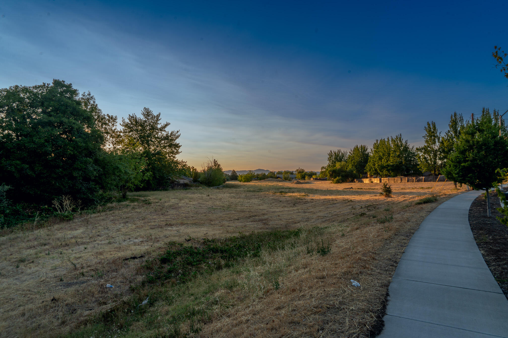 Rare opportunity for a builder to acquire a high-density multi-family development located within an infill location in one of the most desirable parts of Medford. Entitlements have been completed and approved for a 168 unit apartment complex. Property is situated next to a public park and Kennedy Elementary School, offering convenient access to both recreational and educational facilities, ensuring a desirable living environment close to essential amenities. There is a significant undersupply of housing within the Rouge Valley which will further enhance the end value. No comparable opportunities are available in terms of size and location. This is the last parcel available in this area. Contact listing broker for all questions and a complete info package.