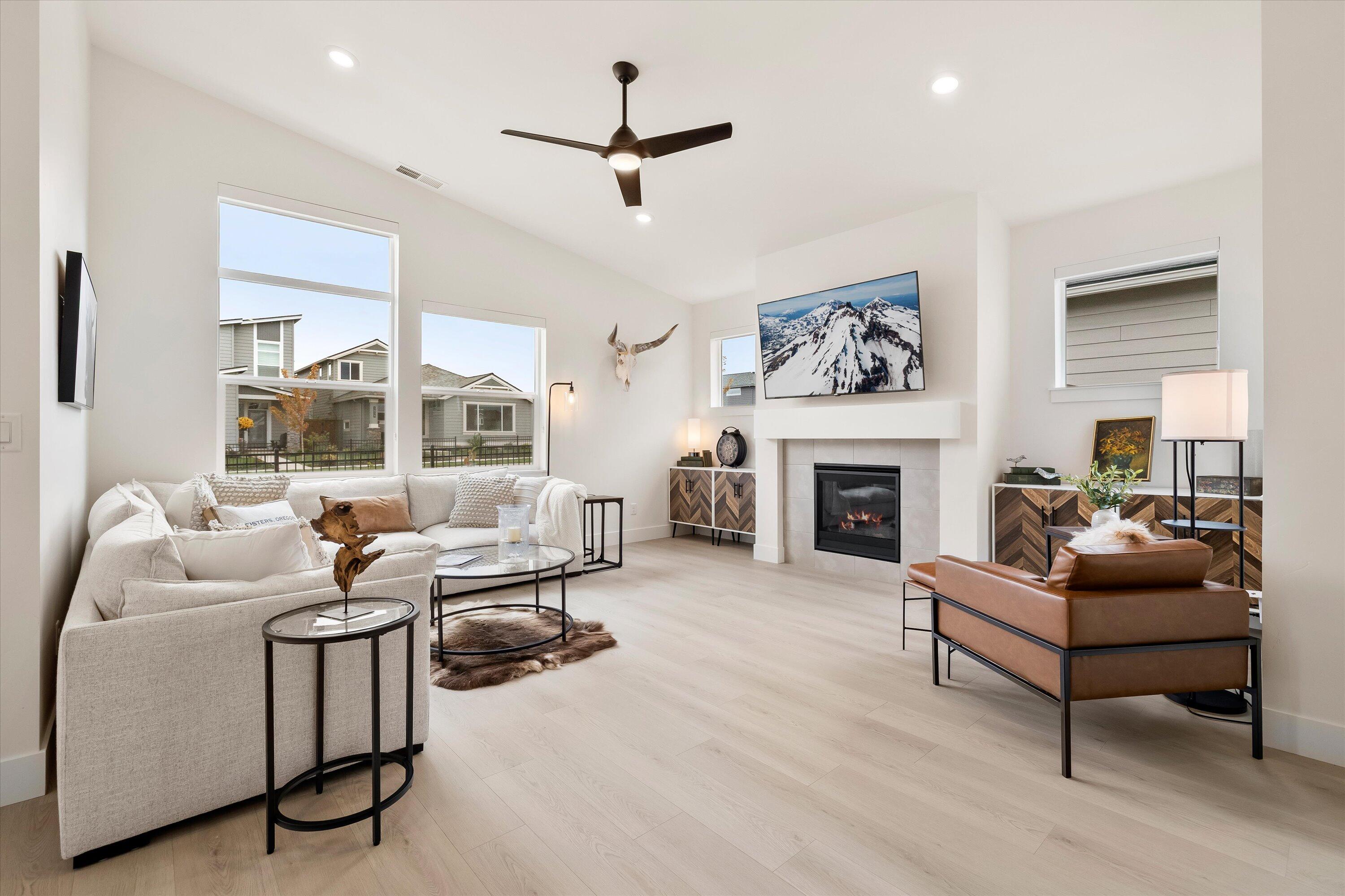 This beautifully designed Everett Floorplan features an open concept living and thoughtful modern finishes throughout. The main level features a conveniently located primary suite, and the 2nd floor offers two additional bedrooms with mountain view's and functional loft space providing plenty of space and comfort for everyone. The heart of the home is the bright and functional kitchen, featuring a large island, quartz countertops, and stainless steel appliances. The kitchen seamlessly flows into the dining and living areas, creating a warm and welcoming space for gatherings. This property is already equipped with AC, custom blinds,  tankless water heater and so much more.  Petrosa community offers a wide range of amenities, including swimming pools, fitness center, parks, green spaces, and miles of paved walking and biking paths, everything you need for active and connected living.