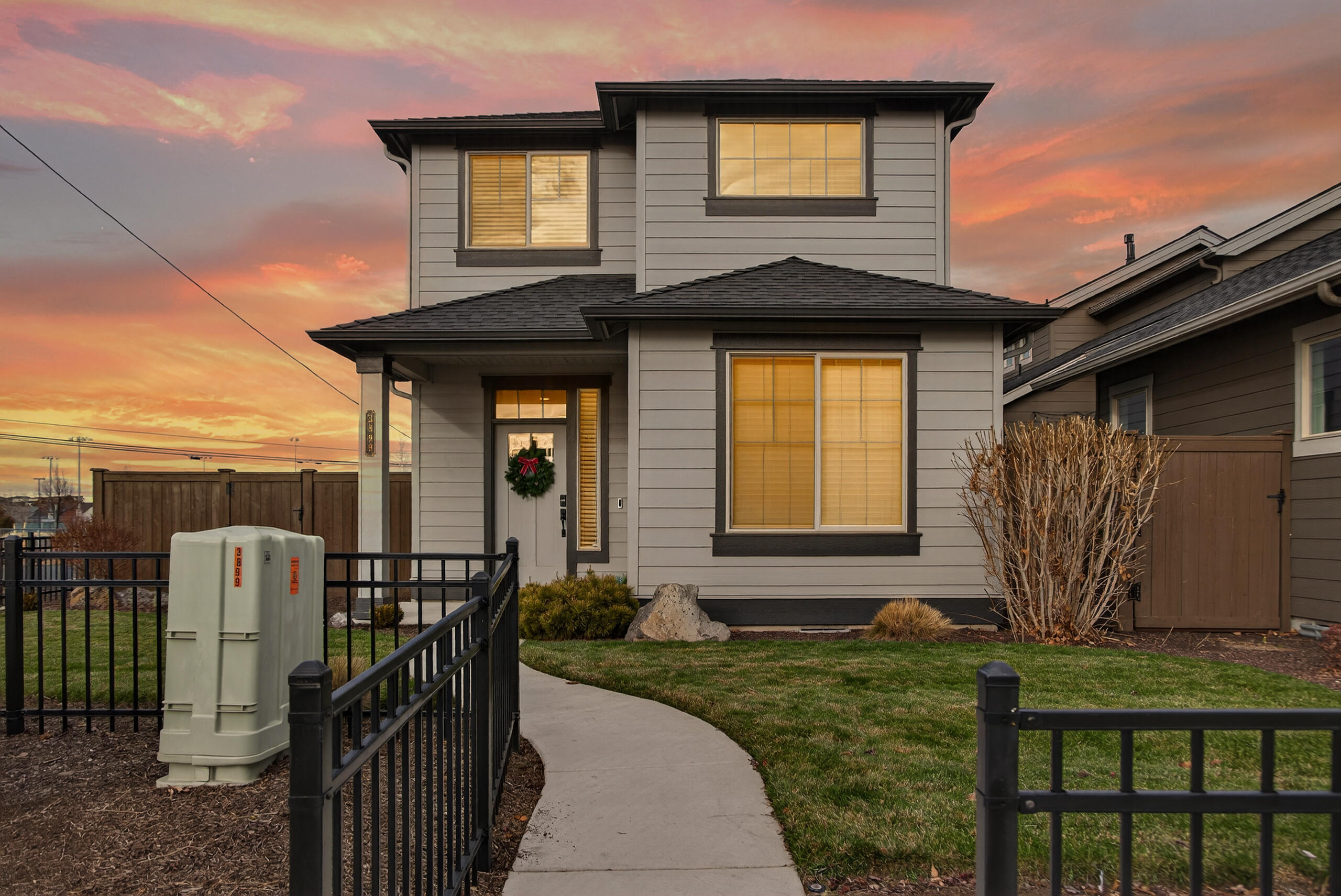 Prime location and move in ready! Spacious and impeccably maintained home by award winning builder Pahlisch Homes. You will love the open concept kitchen/dining/great room. Cozy gas fireplace and sliding glass door leading out to side yard with no neighbor on that side. Quality finishes include: white wood cabinets, quartz kitchen & bathroom counters, large kitchen island, stainless steel appliances, luxury vinyl plank flooring throughout the main level, double wall construction for added insulation, Hardie Plank lap siding, gutters and completely fenced. All appliances included! Bedrooms, bonus area and laundry are upstairs. Office/den and half bath on the main level. Beautifully maintained neighborhood off of SW Canal with easy access to Bend and the airport. Front yard landscaping, access to pool and more provided with the HOA.