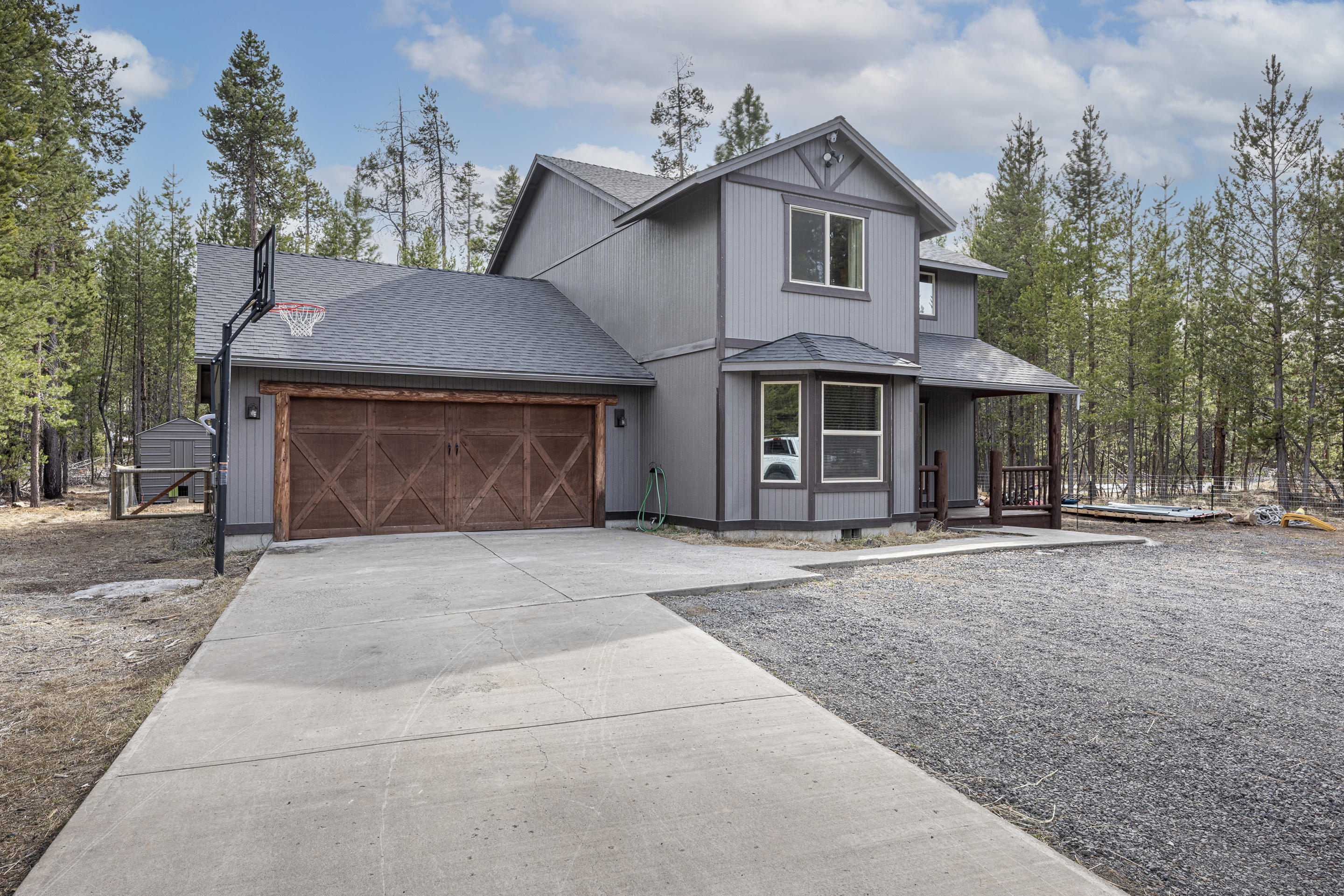 Custom home built by a master builder in 2007 on .49 acres. Real wood features such as open rails, built in book shelf, wood floors, and log accents.4 bed, 2.5 bath. Kitchen pantry and recently updated appliances. Secret door attic access through master. Catalytic EPA rated wood stove. Storage room off garage with extensive shelving. Spa, fenced back yard, treed back property. 2 car garage with plenty of added shelving.  Concrete driveway/sidewalk. 200ft2 covered storage on the side of the house. Private HOA access to Deshutes River dock and boat launch only seconds away. Annual Neighborhood fee is $275.