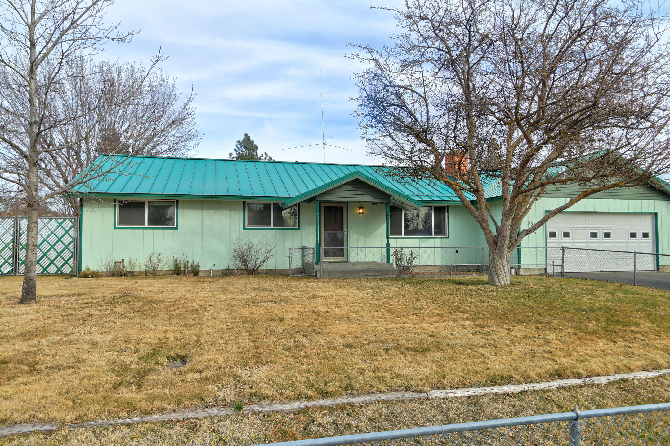 South Suburban home on large fenced in lot. Front yard fenced in as well as back yard. 3 Storage sheds, ample room for RVs on both Sides of house with gate access from the street and driveway. Home has communication tower; although the equipment has long been removed. Sale is an estate sale, commissions will not be paid on contribution.  Please allow 2 day response time for attorney review.