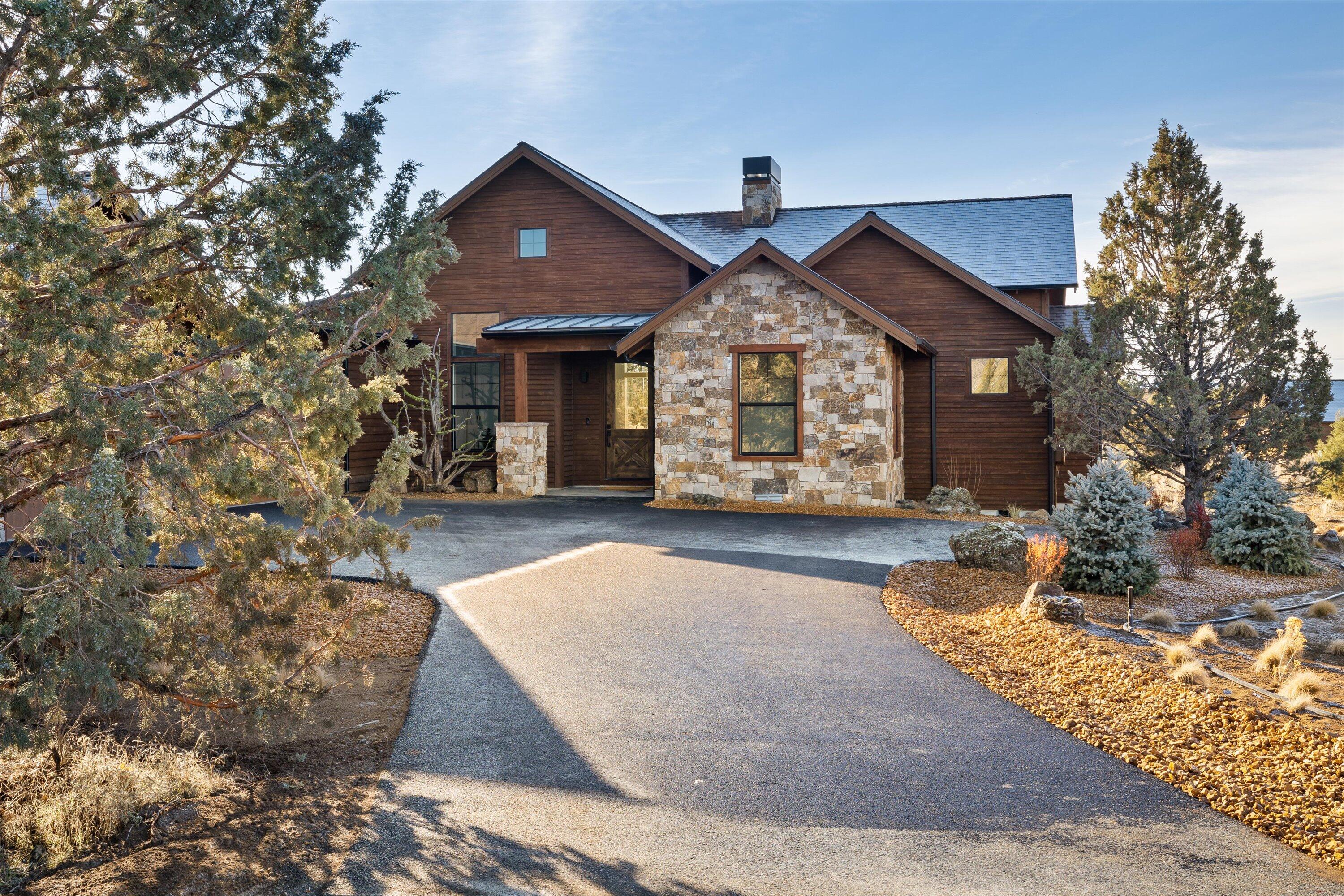 Welcoming New Construction one-level NW style home accentuated with stone accents and stained wood siding on the exterior. This home is well situated on the Westside at Brasada Ranch and features dramatic Cascade Mountain views from the rear of the home and outdoor living area. As you enter the home you will find sunlight fills the great room through the expansive windows. High ceilings lend space for the stone fireplace surrounded by exquisitely crafted built-ins. The kitchen features stainless steel appliances and a large walk-in pantry. Slab countertops and island are perfect for the home chef. Beautiful hardwood flooring throughout the living areas. The primary suite is situated on one side of the home offering a peaceful oasis with a large walk-in closet and oversized soaking tub. This home offers a den/office space, two additional bedrooms and roomy garage.