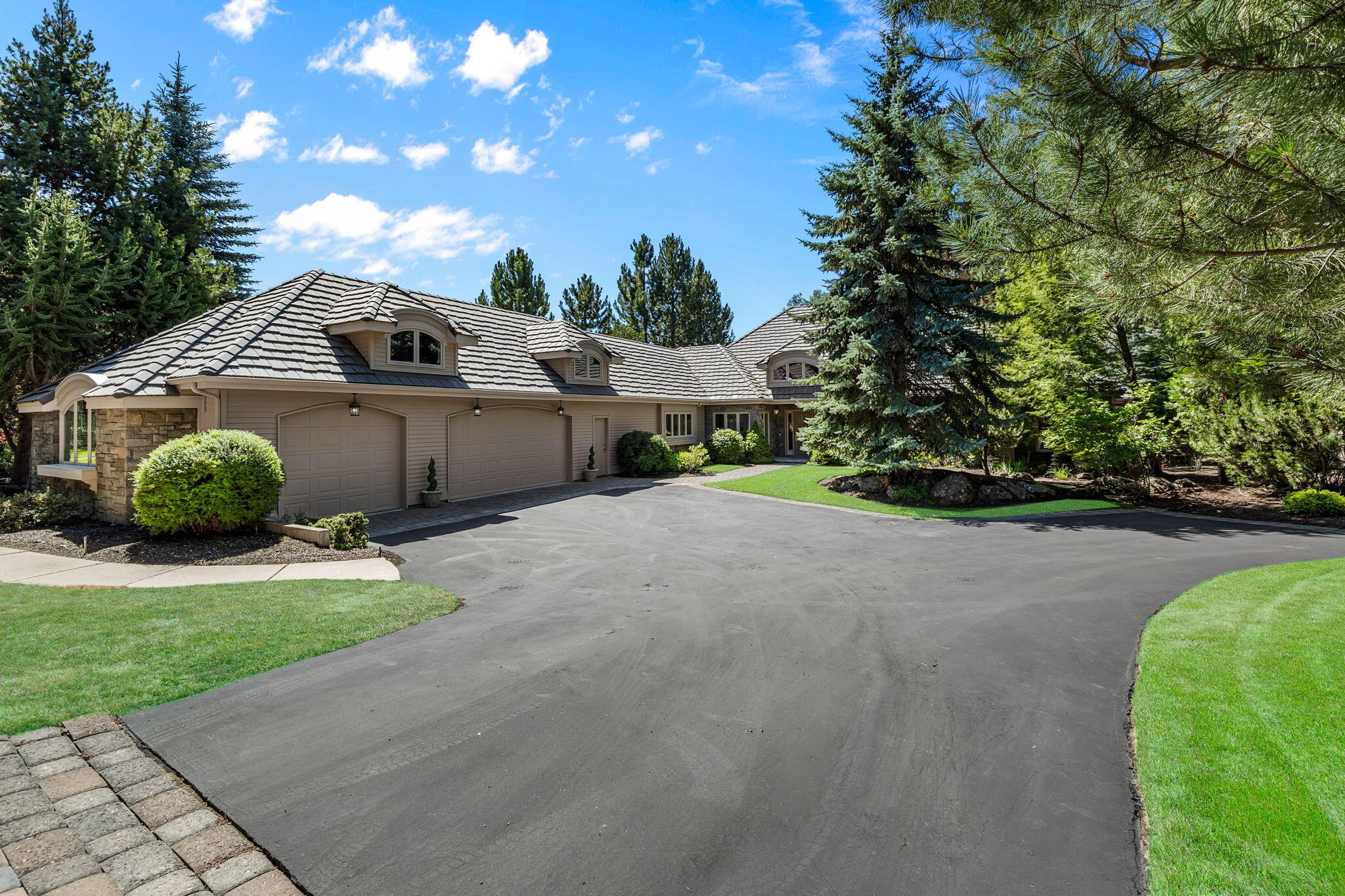 Picturesque lake and 17th-fairway views from this beautifully remodeled single-level Broken Top home, set on a mature landscaped lot with front and back water features adding to the peaceful ambiance. Interiors intertwine luxury with comfortable living spaces, where the spacious living area's wall of windows showcases the outdoors and custom built-ins add warmth. A cheerful breakfast nook adjoins the gourmet kitchen with 2 Wolf ovens, Fisher & Paykel dishwasher, island with gas cooktop, wine fridge & breakfast bar; an elegant dining room sits nearby. The floorplan provides an ideal separation of space, offering an office large enough to double as a den, complete with cozy fireplace. The primary suite, with its own private golf-course-view patio, includes a luxurious remodeled bath & walk-in closet. On the opposite end of the home, the guest wing features two bedroom suites with adjoining sitting area. Expansive laundry room & large 3-car garage complete this remarkable home.