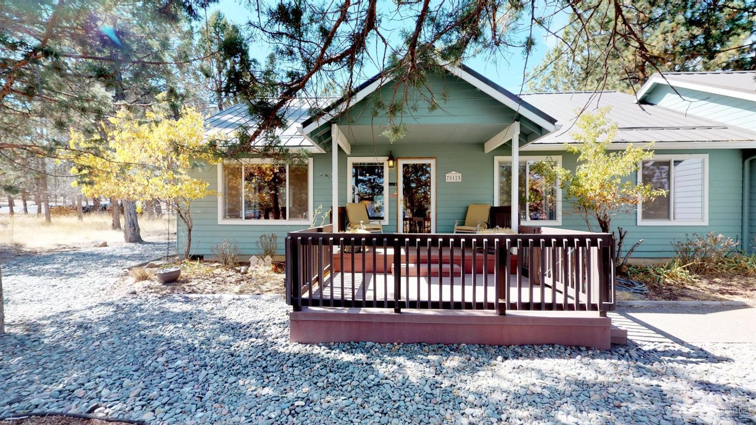 Sister's Country easy living in this 1600sf single level home on .89 acres parcel. Fabulous open floor plan boasting plenty of cabinets and storage throughout. 1200sf dream shop built in 2007 with separate electric meter. Shop is finished, heated, great lighting and with 220. 800sf guest suite/office/studio above shop complete with 3/4 bath, office desk area, propane fireplace, separate water heater, A/C, tile/carpet flooring. RV hook-up and so much more. Hardiplank and metal roof on both structures.