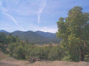 Absolutely gorgeous building parcel w/new road, well, electricity to pad, homesite & sand filter septic approval. Sits way off the road w/Swiss Alps views, privacy, trees & ready to build on today.