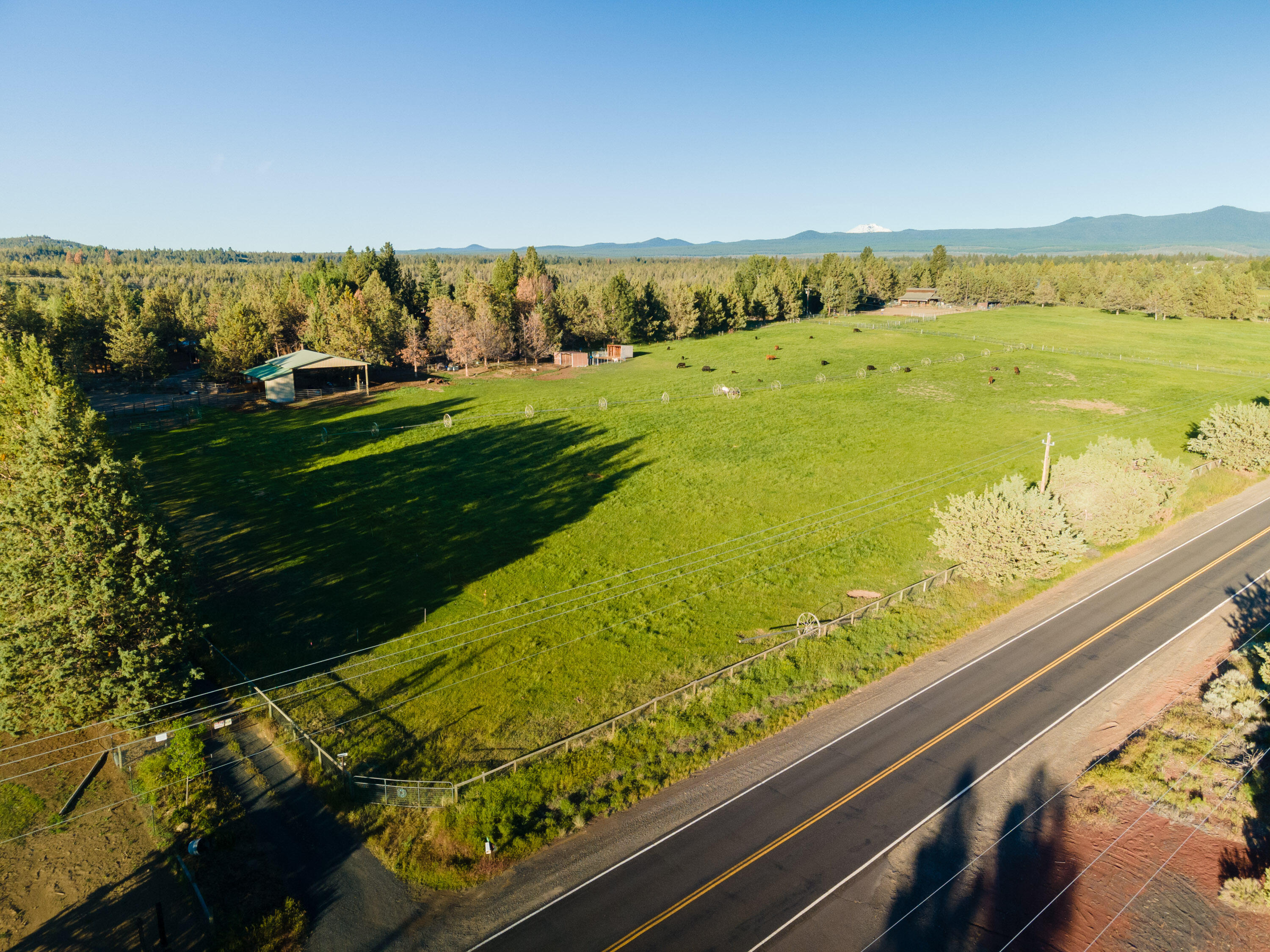 Amazing opportunity to own your own slice of paradise on Tumalo Reservoir Rd. Beautiful 20 acre property nestled in an area of multi-million dollar homes! Bring your creativity and vision to this 3 bed/2bath unique, rustic home complete with enchanting backyard, pool and old growth juniper trees. Tons of character and country charm!  Property includes 7 acres of irrigated pasture, fenced/cross fenced, custom catio, tons of outbuildings including 2 barns, set up for horses, cows, chickens and more. Home and property are in need of TLC and priced accordingly, home and property are being sold ''As-Is''.