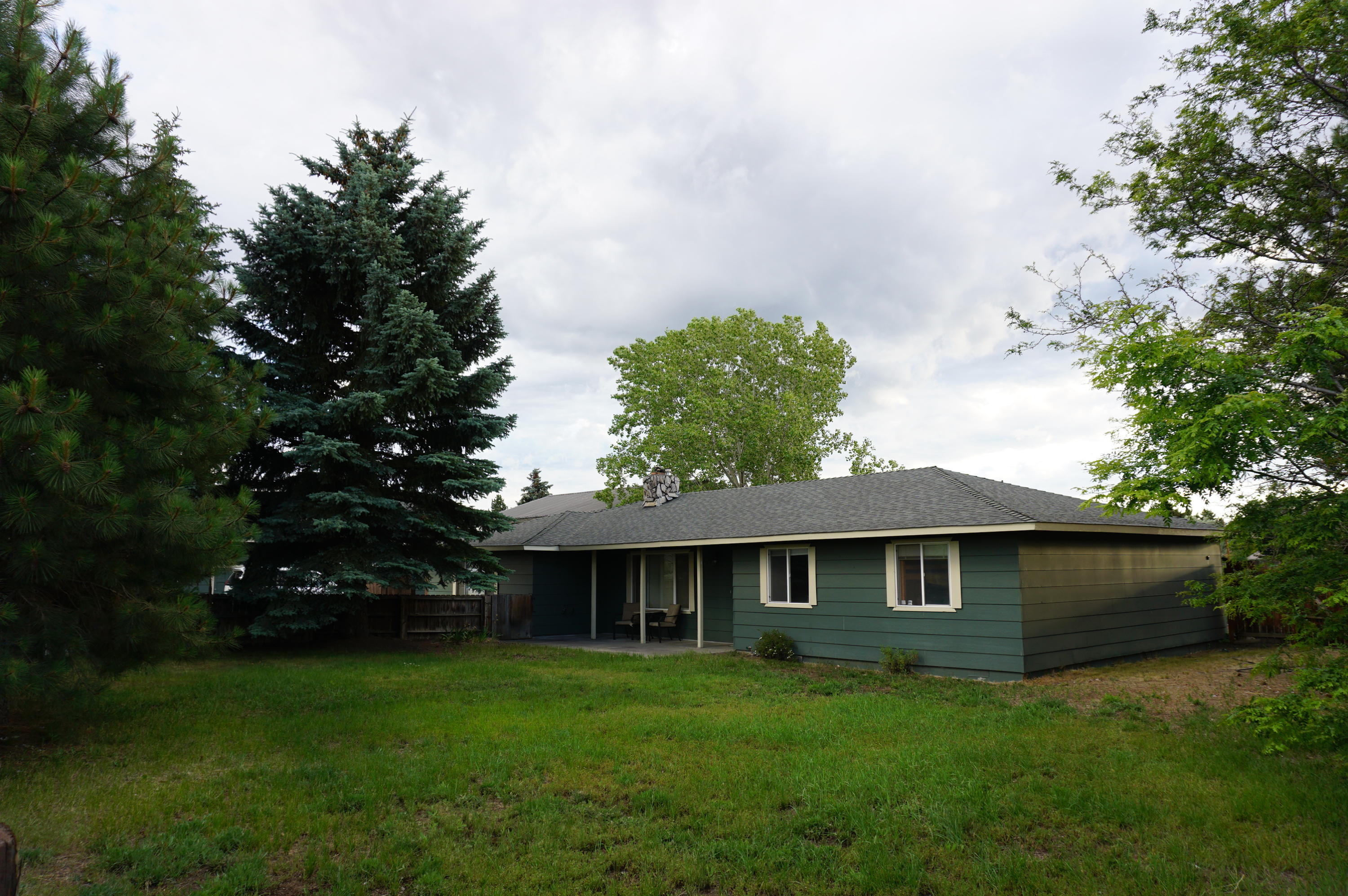 Comfortable 3 bedroom 2.5 bath house on 1.12 acres in SE Bend. Includes 23'x47' detached garage with two 240v outlets and a 30x40 enclosed pole-barn. This property has great views of the cascade mountains and an acre of COI irrigation. Enjoy the space to store all your toys and the benefits of being in town. Great view of the cascades from the dining room, master bedroom or covered back patio. This 1.12 acre property is zoned RS and inside the UGB and has great development potential. This may be a also be great site for a home based business or urban homesteading.
