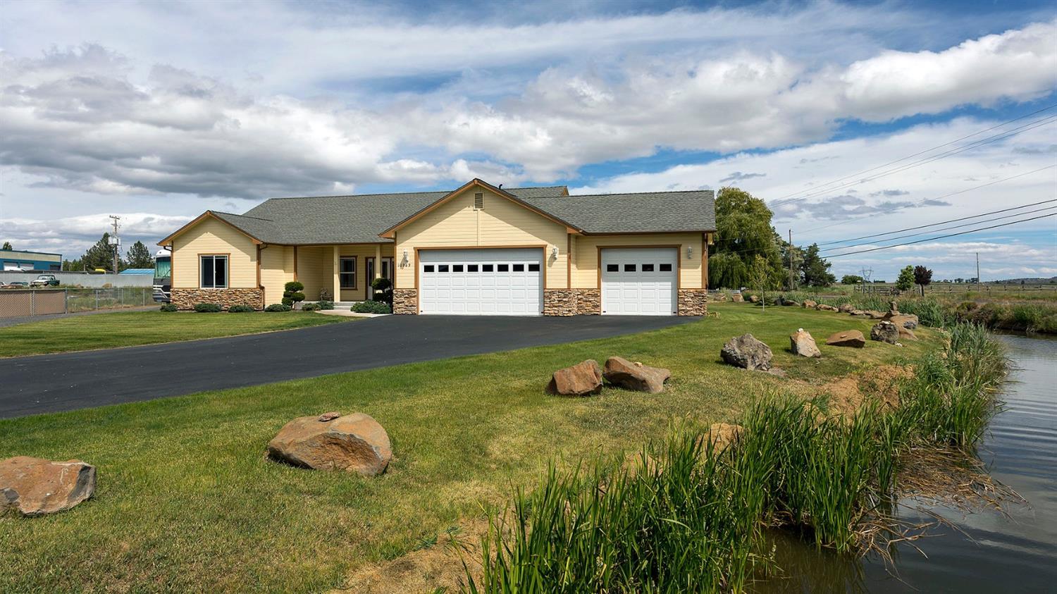 Gorgeous newer home on 1.01 acres just minutes from town. Built in 2006 this spacious 3 Bedroom 2 bath home has all the amenities. Such as 9 foot and vaulted ceilings, Gas heat and fireplace, Top notch water filtration system (just serviced) Sun room with separate heat and air conditioning along with a newer spa. Kitchen/dining room includes custom Bettencourt cabinets with pull out pan drawers and a large pantry. Tile floors and counter tops with all the appliances including a brand new refrigerator. Seller is also including a high end steam washer and dryer set. The master bedroom and bathroom are spacious with a walk in closet, jacuzzi tub, separate tile shower, brand new air flush toilet and a door out onto the rear deck. The other two bedrooms are good sized with ample closets. The three car garage features automatic openers and is plumbed for a gas heater. Property includes a 4 yr old 24 x 48 RV storage/shop with full RV hook ups.